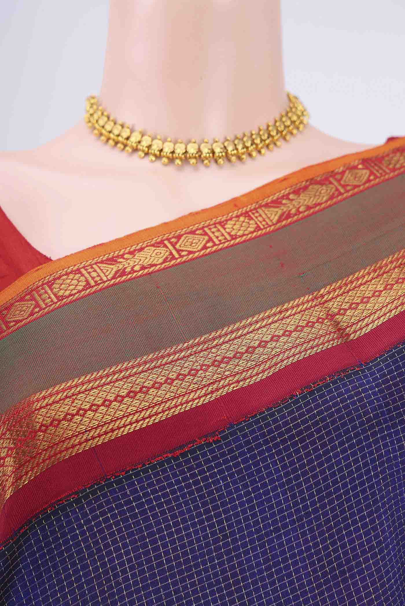 Border image of Dark Blue Silk Cotton Saree with Checked design on the body and Zari Border. 