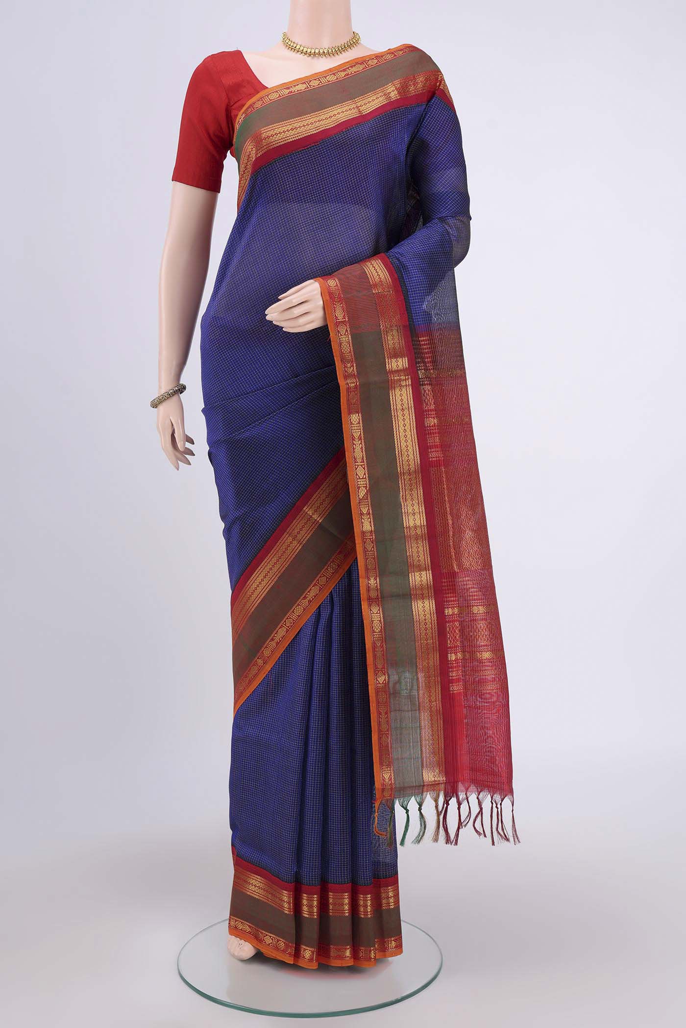 Dark Blue Silk Cotton Saree with Checked design on the body and Zari Border.  displayed on a mannequin