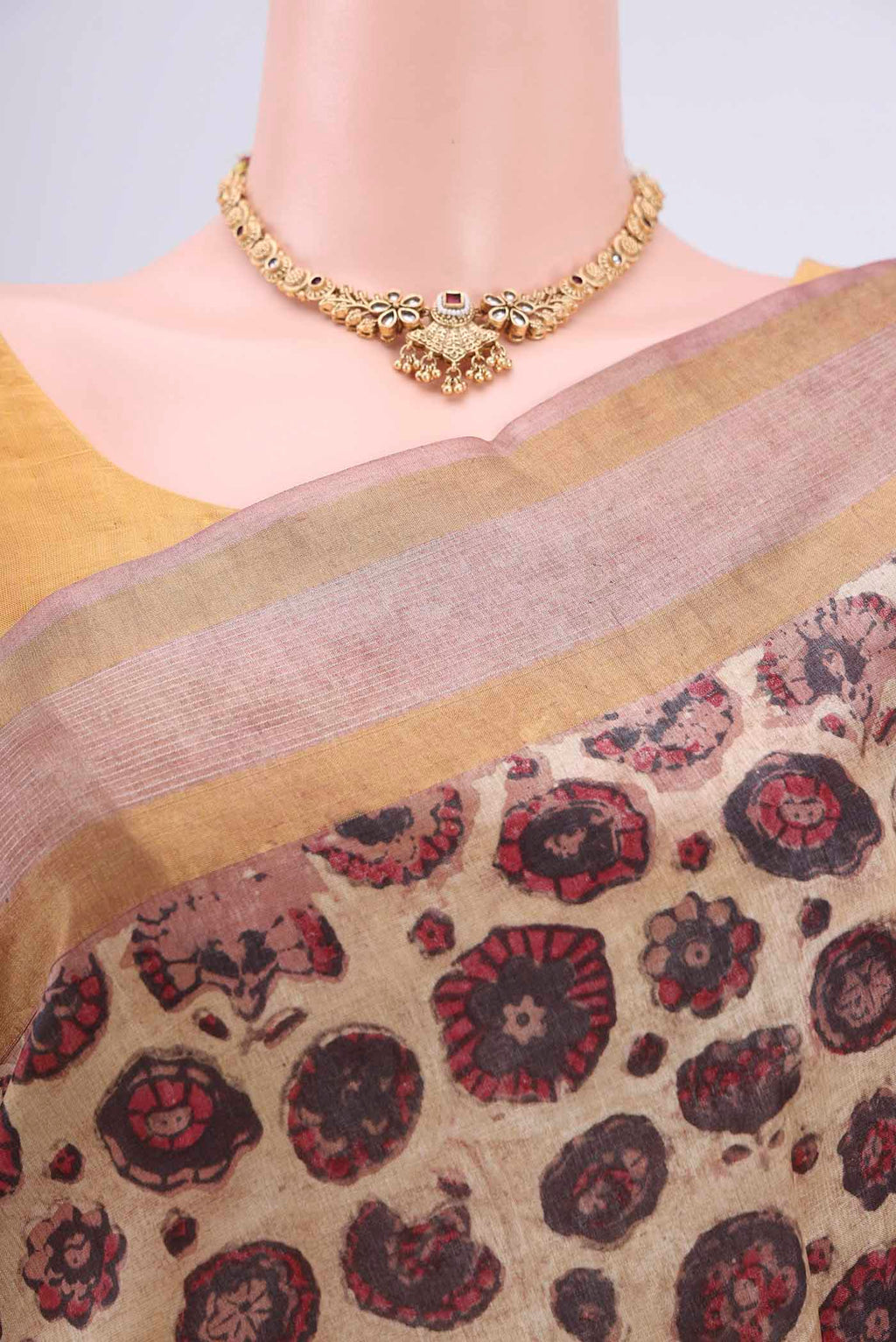 Border image of Beige Tussar Silk Saree with kalamkari Print on the body and Zari Border. 