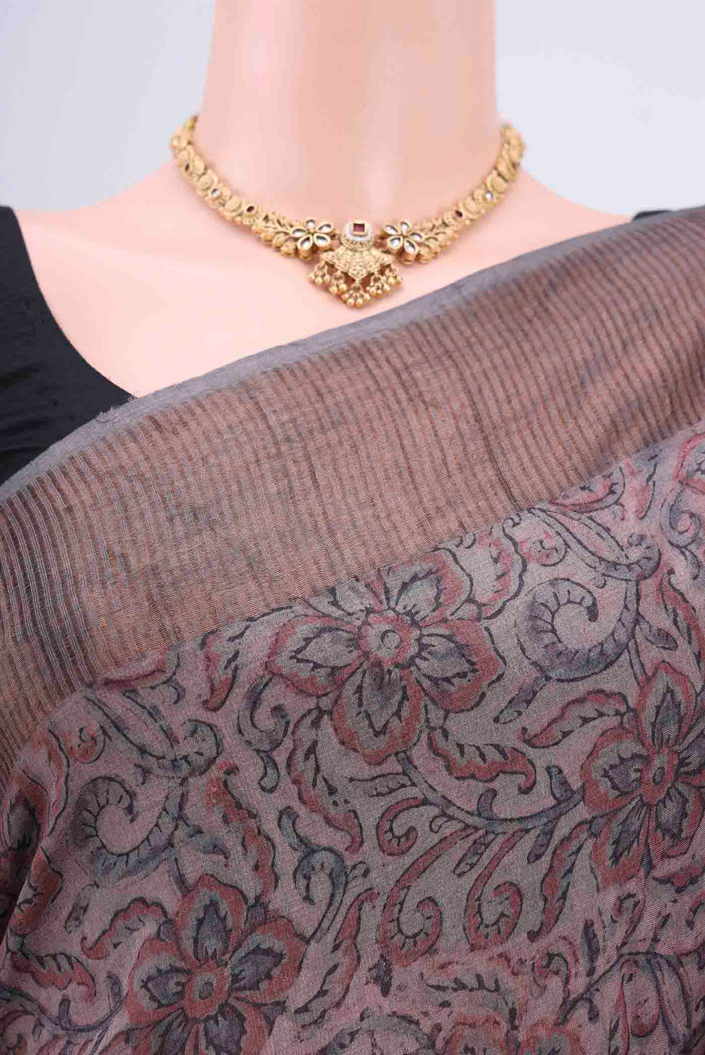 Border image of Dark Mauve Tussar Silk Saree with kalamkari Print on the body and Zari Border. 