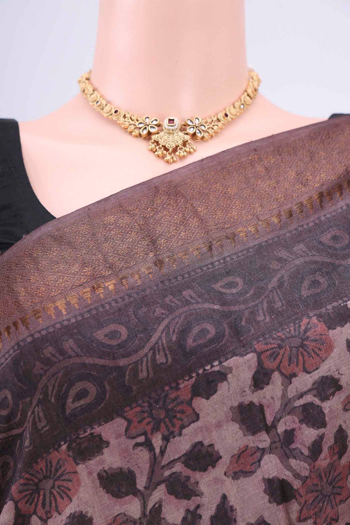 Border image of Dark Mauve Tussar Silk Saree with kalamkari Print on the body and Zari Border. 