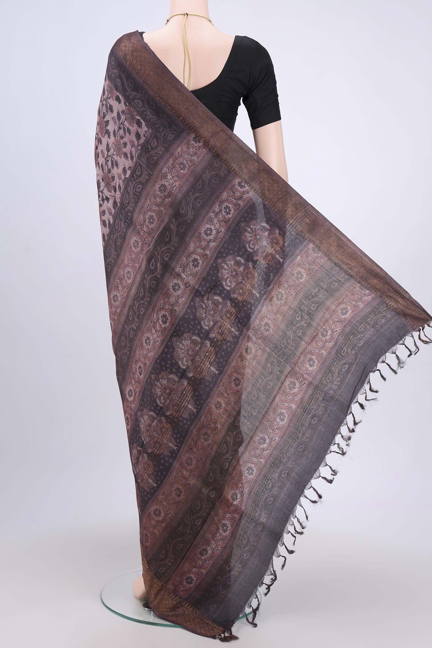 Flat view of Brown Tussar Silk Saree with Floral Print on the body and Zari Border. 