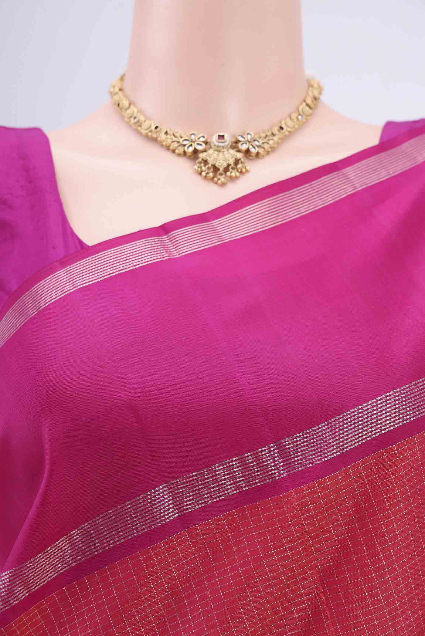 Border image of Dark Pink Kanchipuram Silk Saree with Checked design on the body and Zari Border. 