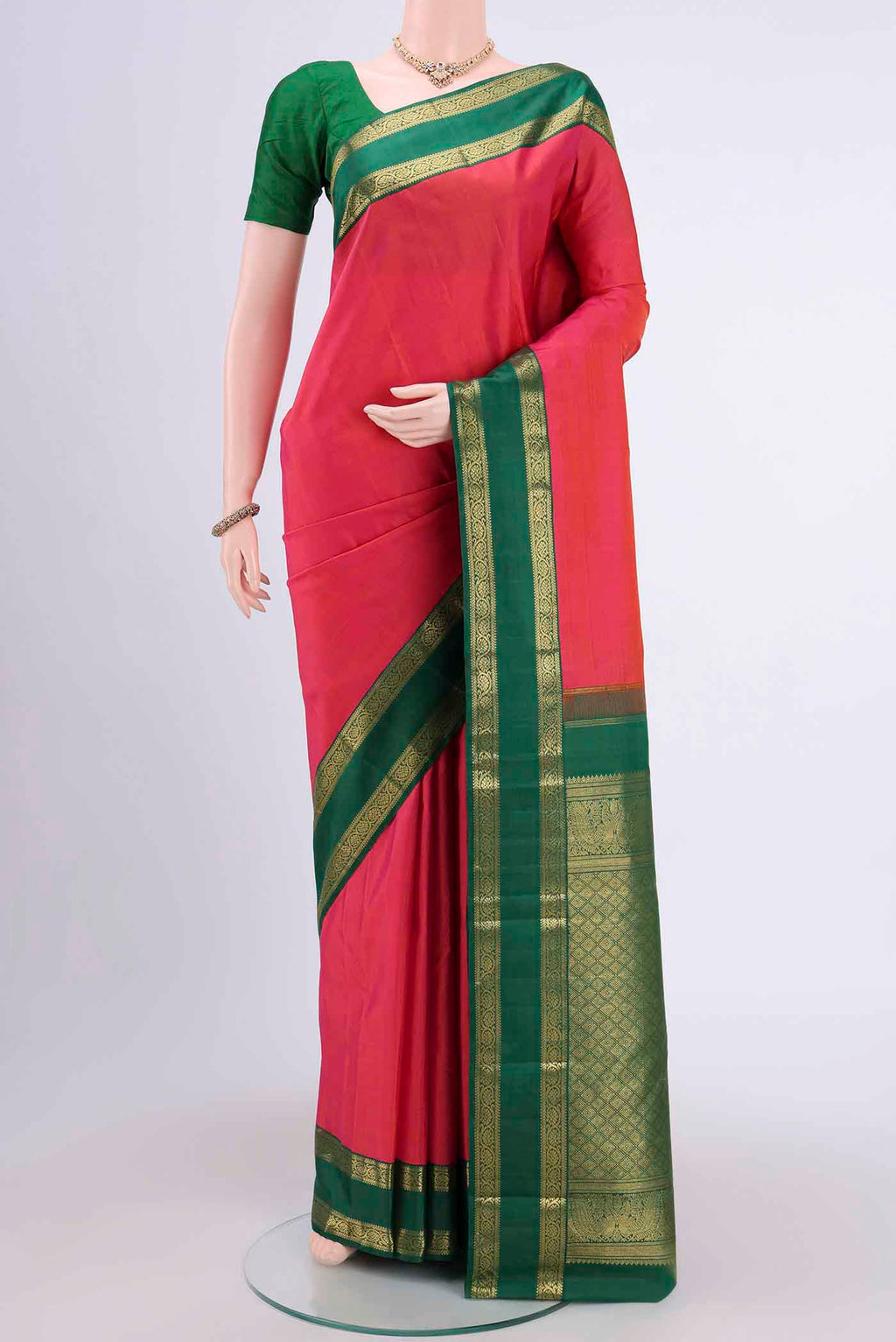 Dark Pink Kanchipuram Saree with Plain Body and Zari Border displayed on a mannequin