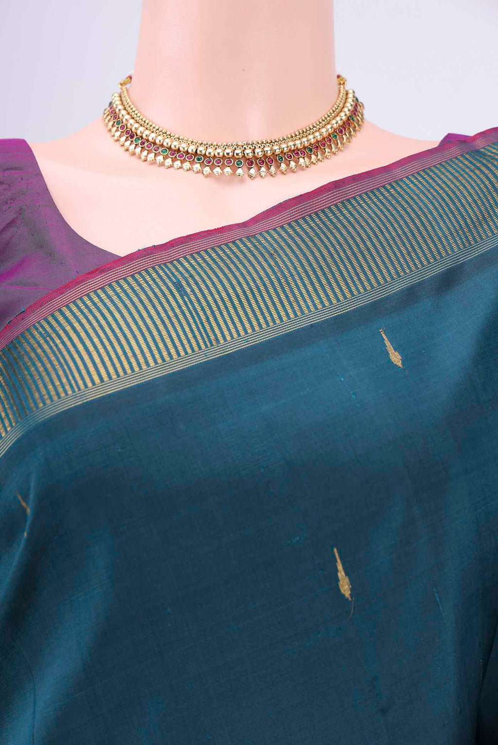 Border image of Peacock Blue Kanchipuram Saree with Zari Butta on the body and Zari Border. 