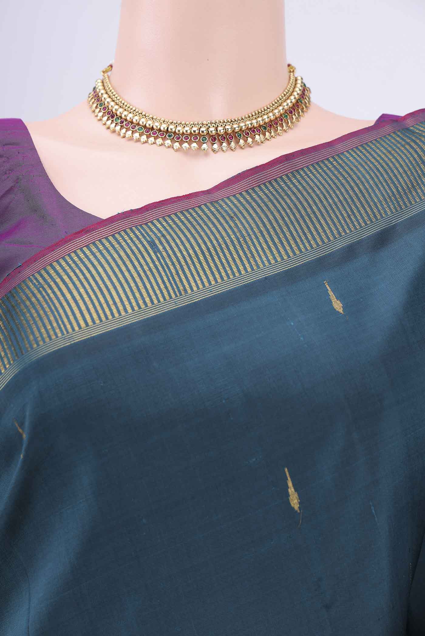 Border image of Peacock Blue Kanchipuram Saree with Zari Butta on the body and Zari Border. 