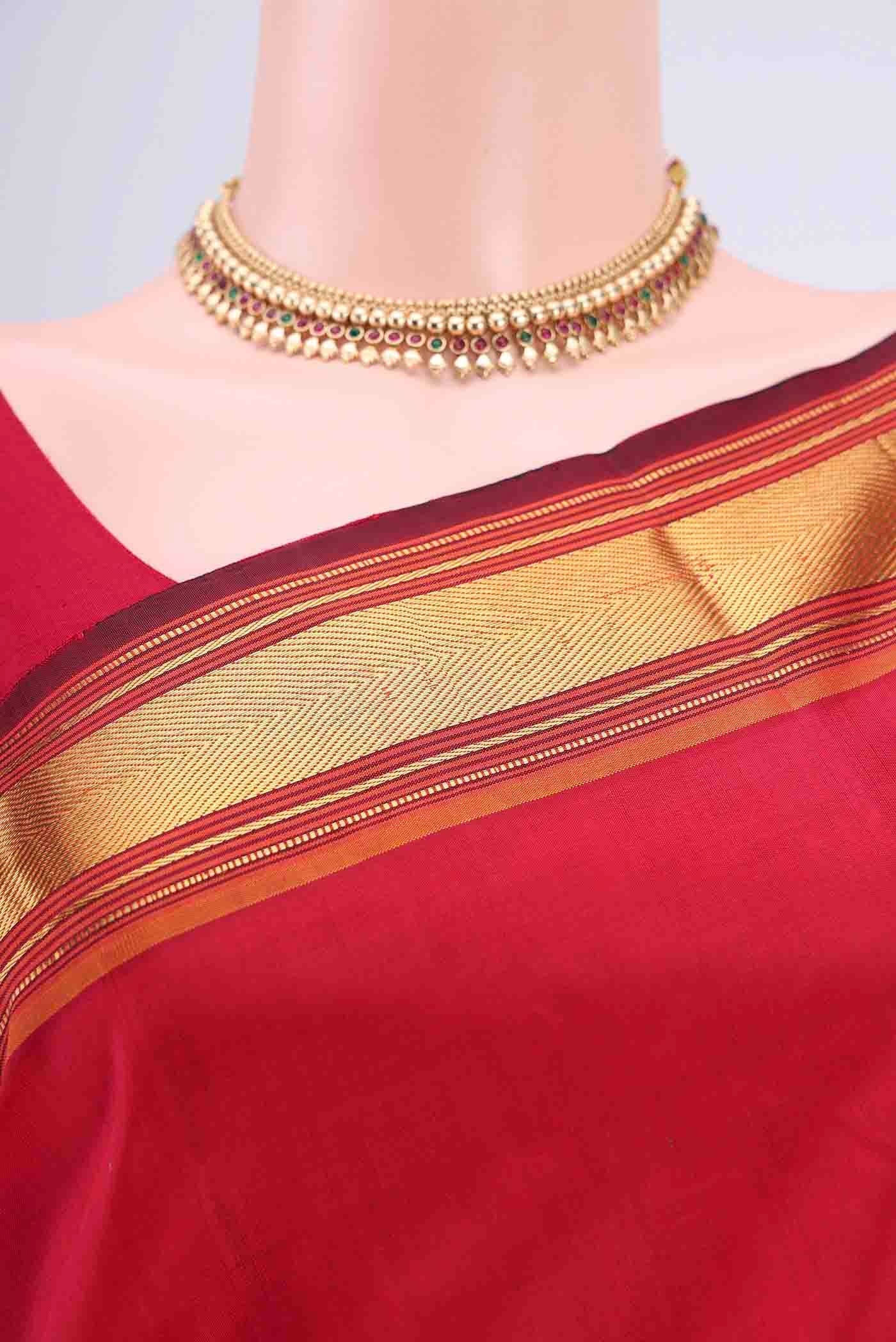 Border image of Red Kanchipuram Saree with Plain Body and Zari Border. 