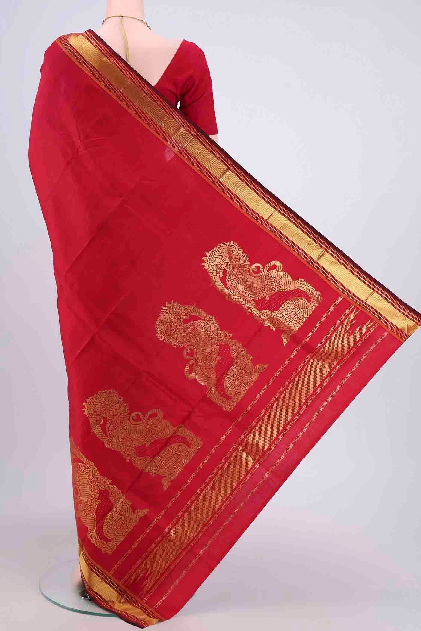 Flat view of Red Kanchipuram Saree with Plain Body and Zari Border. 