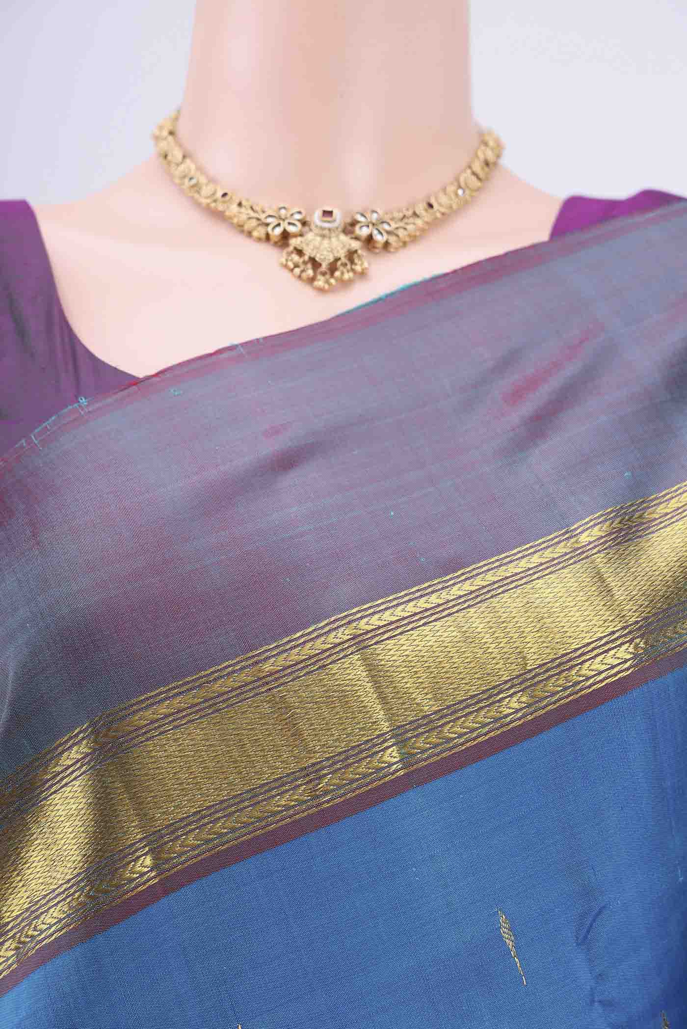 Border image of Blue Kanjivaram Saree with Zari Butta on the body and Zari Border. 