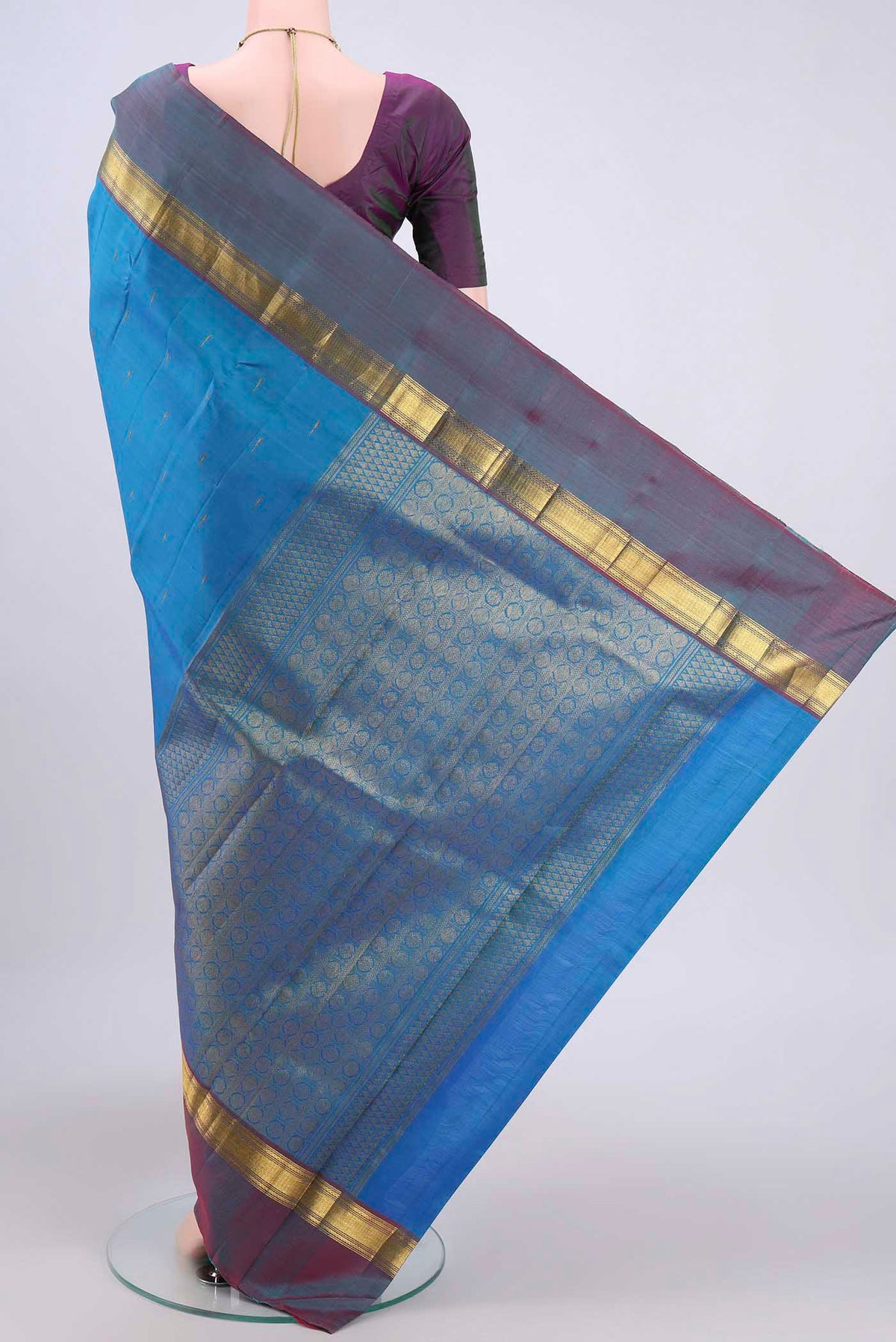 Flat view of Blue Kanjivaram Saree with Zari Butta on the body and Zari Border. 