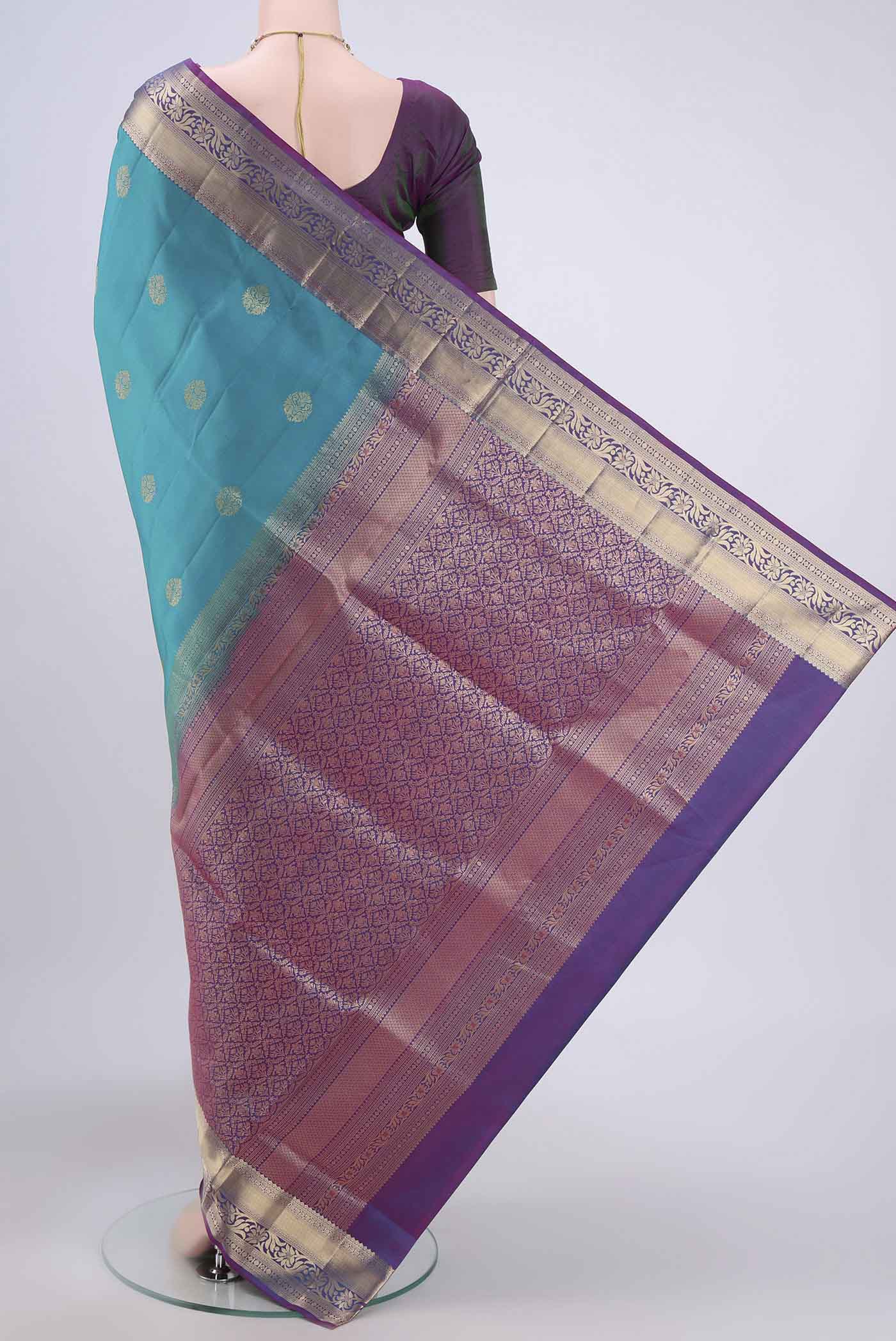 Flat view of Sea Green Soft Silk Saree with Zari Butta on the body and Zari Border. 