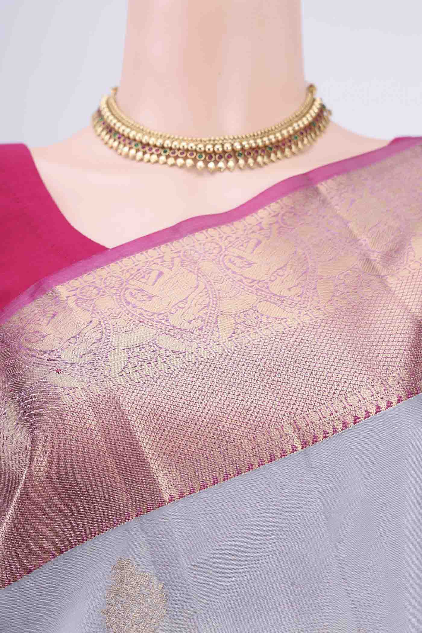 Border image of Grey Soft Silk Saree with Zari Butta on the body and Fancy Border. 