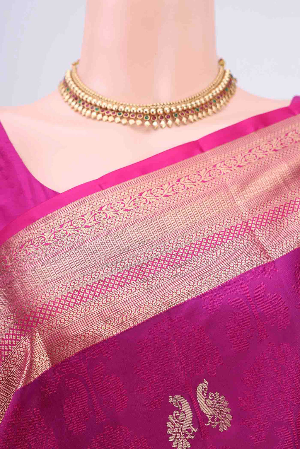 Border image of Magenta Dual Tone Soft Silk Saree with Jacquard With Zari Butta on the body and Zari Border. 