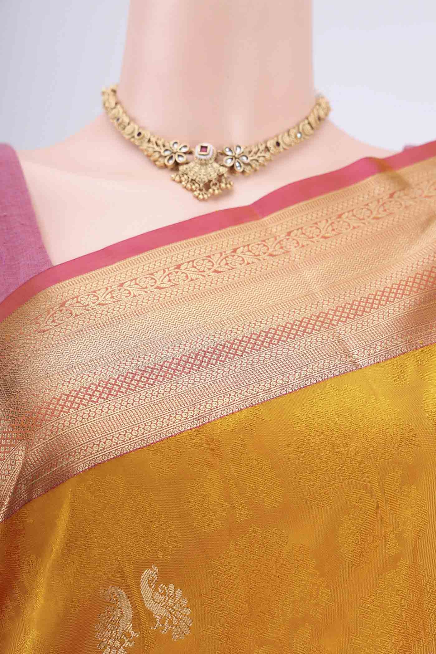 Border image of Mustard Soft Silk Saree with Jacquard With Zari Butta on the body and Zari Border. 