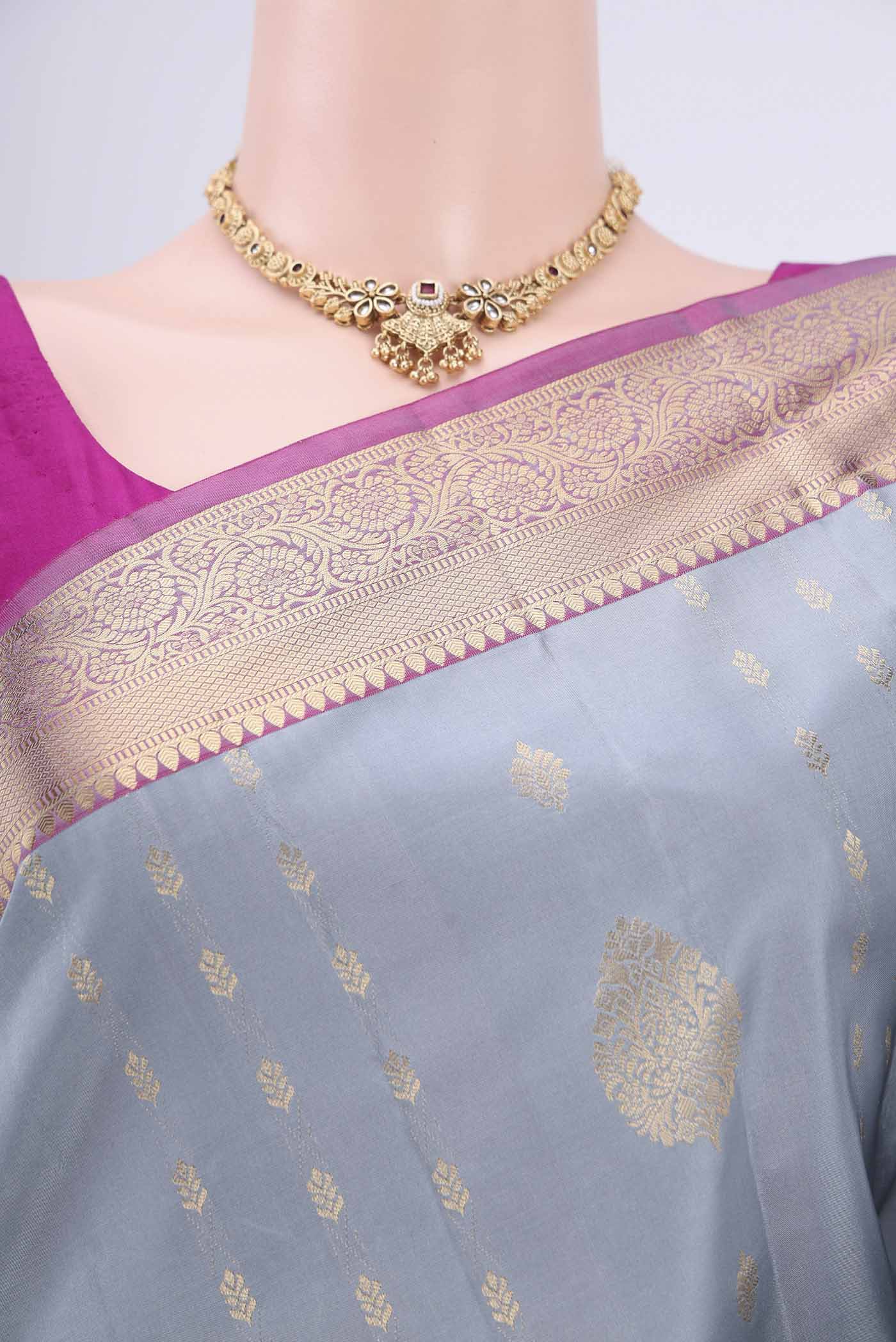 Border image of Grey Soft Silk Saree with Zari Butta on the body and Zari Border. 