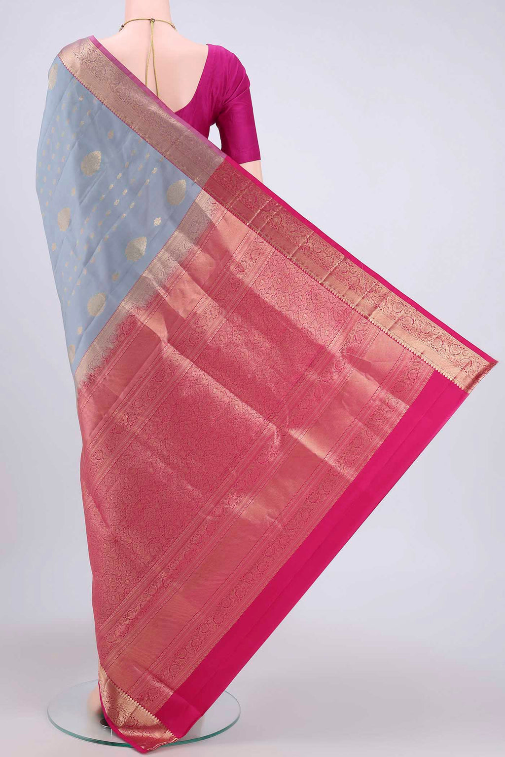 Flat view of Grey Soft Silk Saree with Zari Butta on the body and Zari Border. 