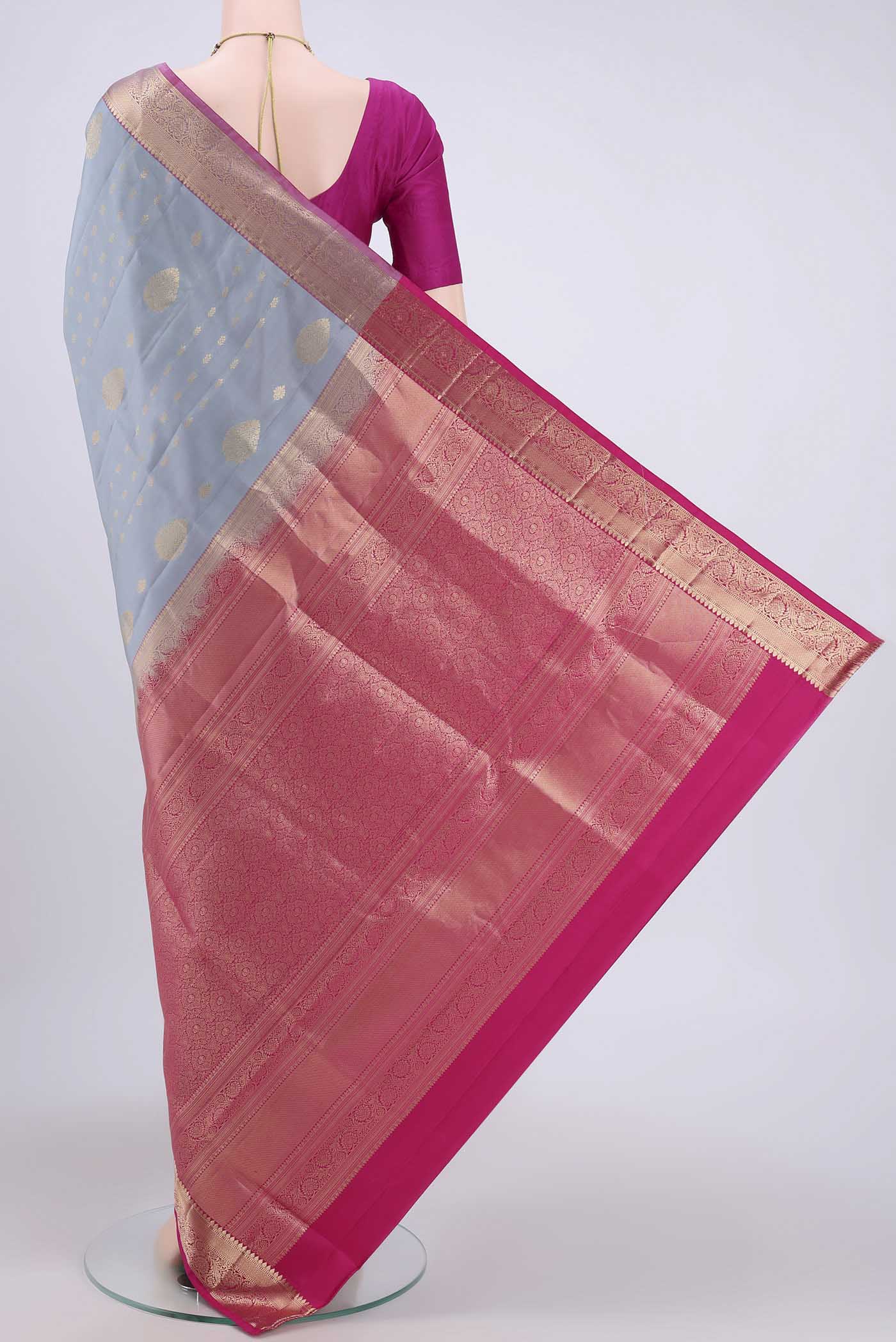 Flat view of Grey Soft Silk Saree with Zari Butta on the body and Zari Border. 