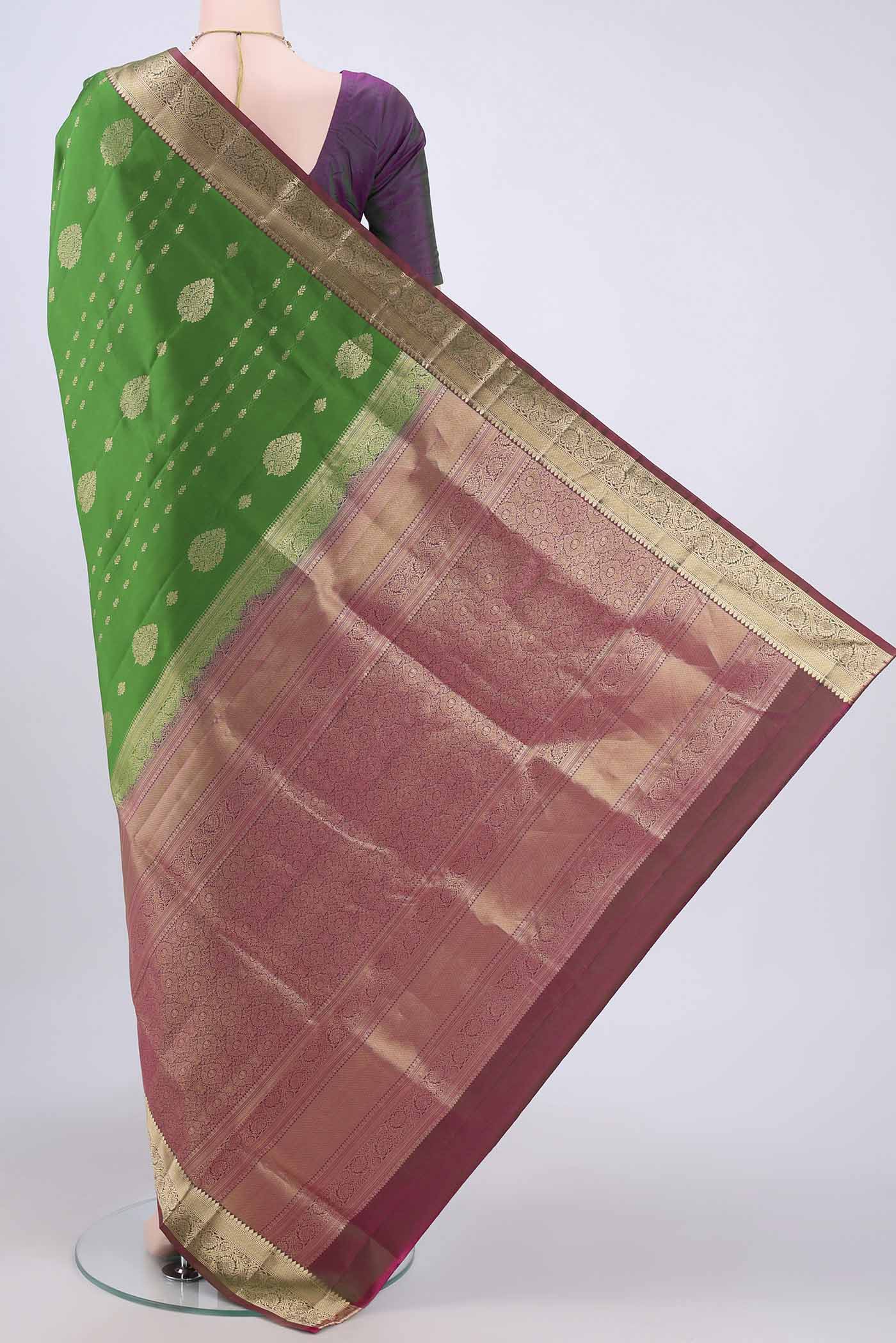 Flat view of Green Soft Silk Saree with Zari Butta on the body and Zari Border. 