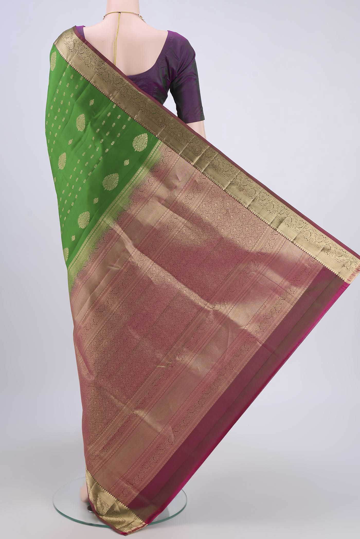 Flat view of Green Soft Silk Saree with Zari Butta on the body and Fancy Border. 
