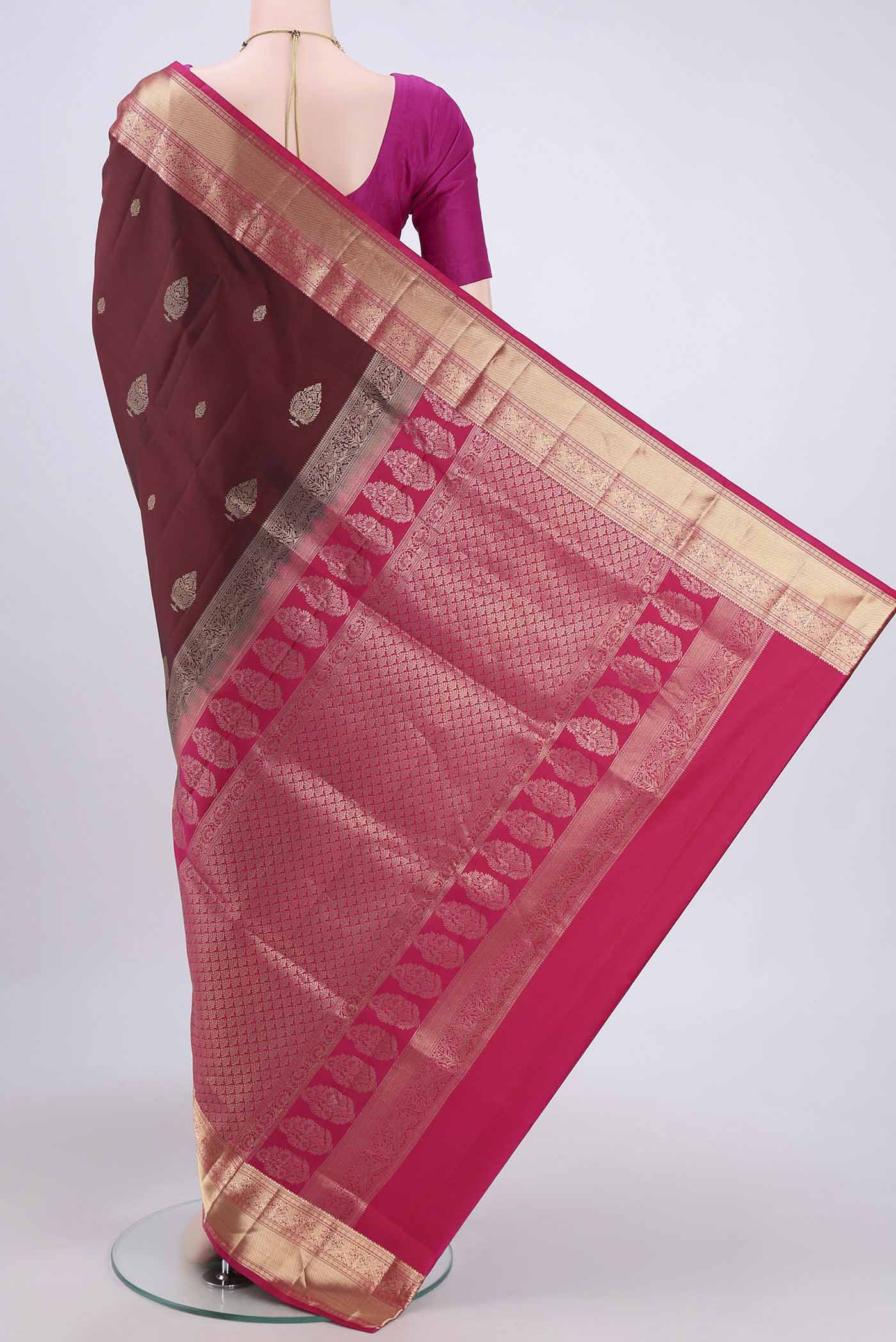 Flat view of Maroon Soft Silk Saree with Zari Butta on the body and Zari Border. 