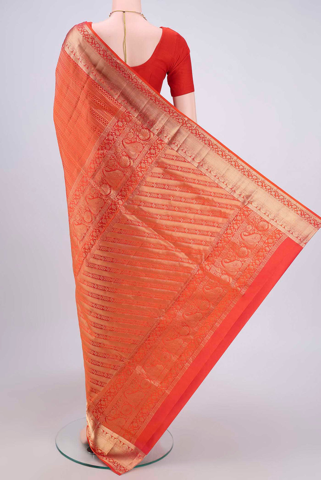 Flat view of Brick Orange Dual Tone Soft Silk Saree with Zari Brocade on the body and Zari Border. 
