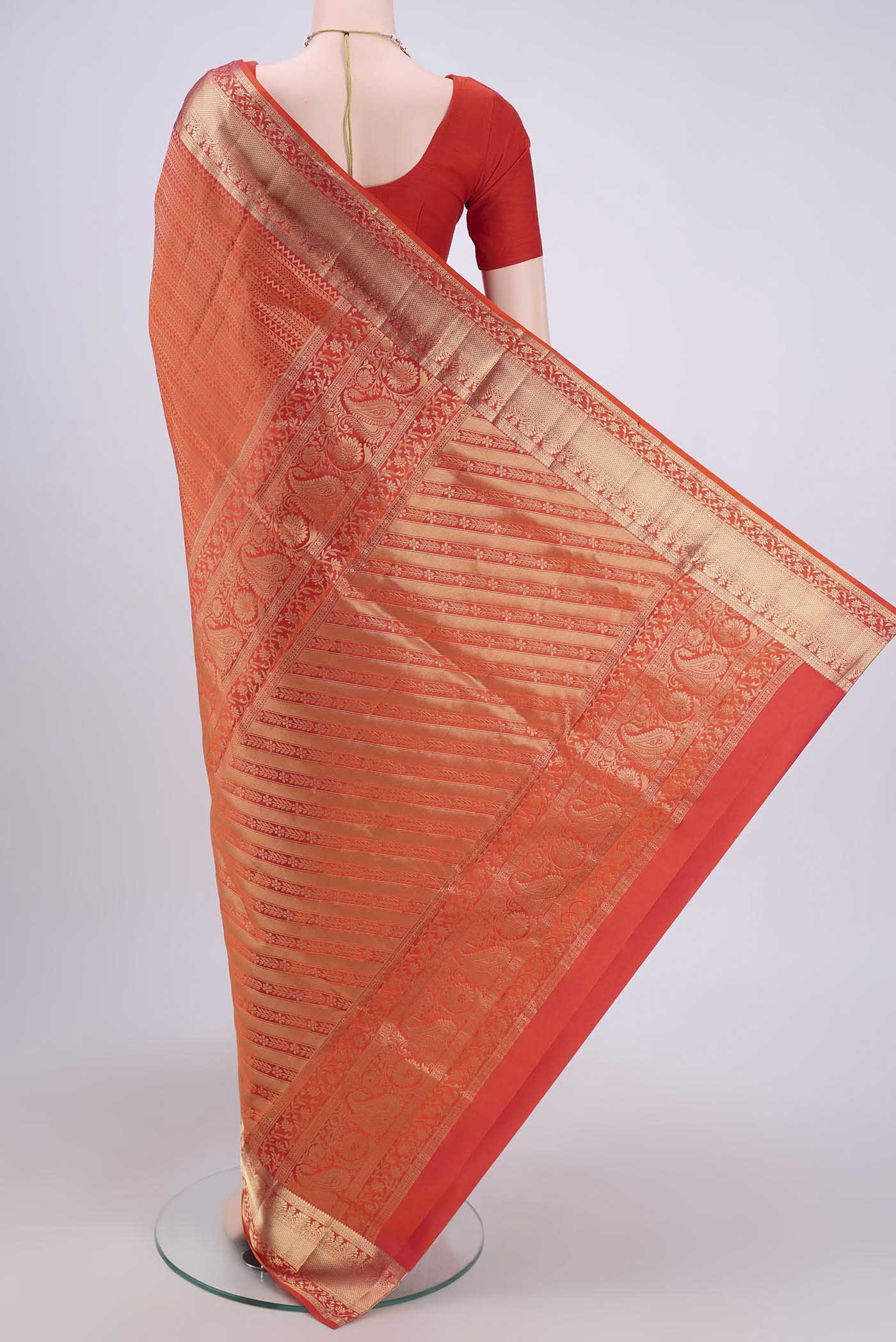Flat view of Brick Orange Dual Tone Soft Silk Saree with Zari Brocade on the body and Zari Border. 