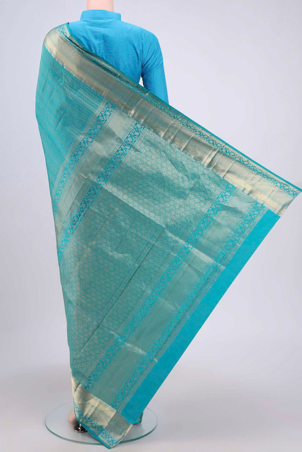 Flat view of Sea Green Soft Silk Saree with Zari Brocade on the body and Zari Border. 