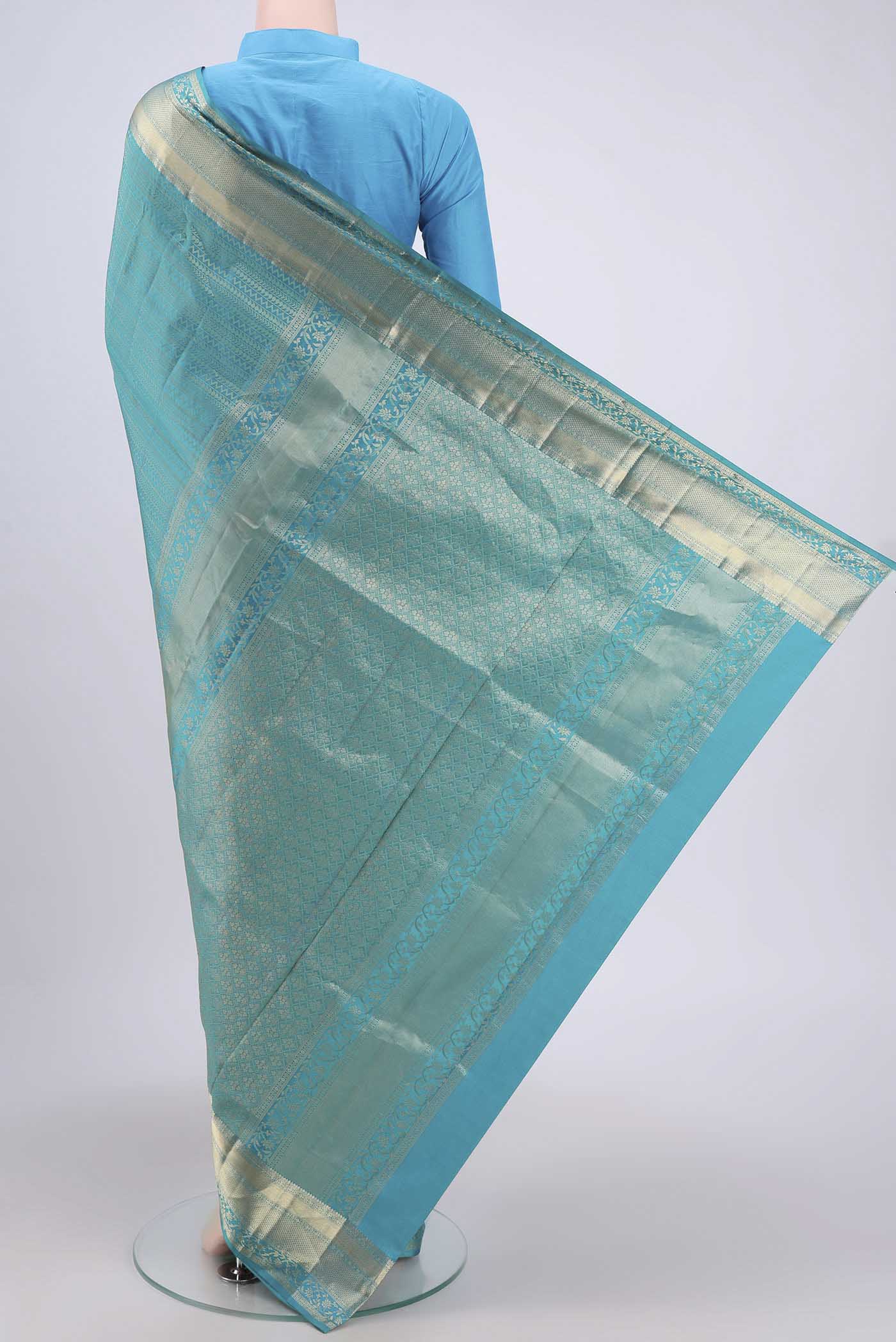 Flat view of Sea Green Soft Silk Saree with Zari Brocade on the body and Zari Border. 