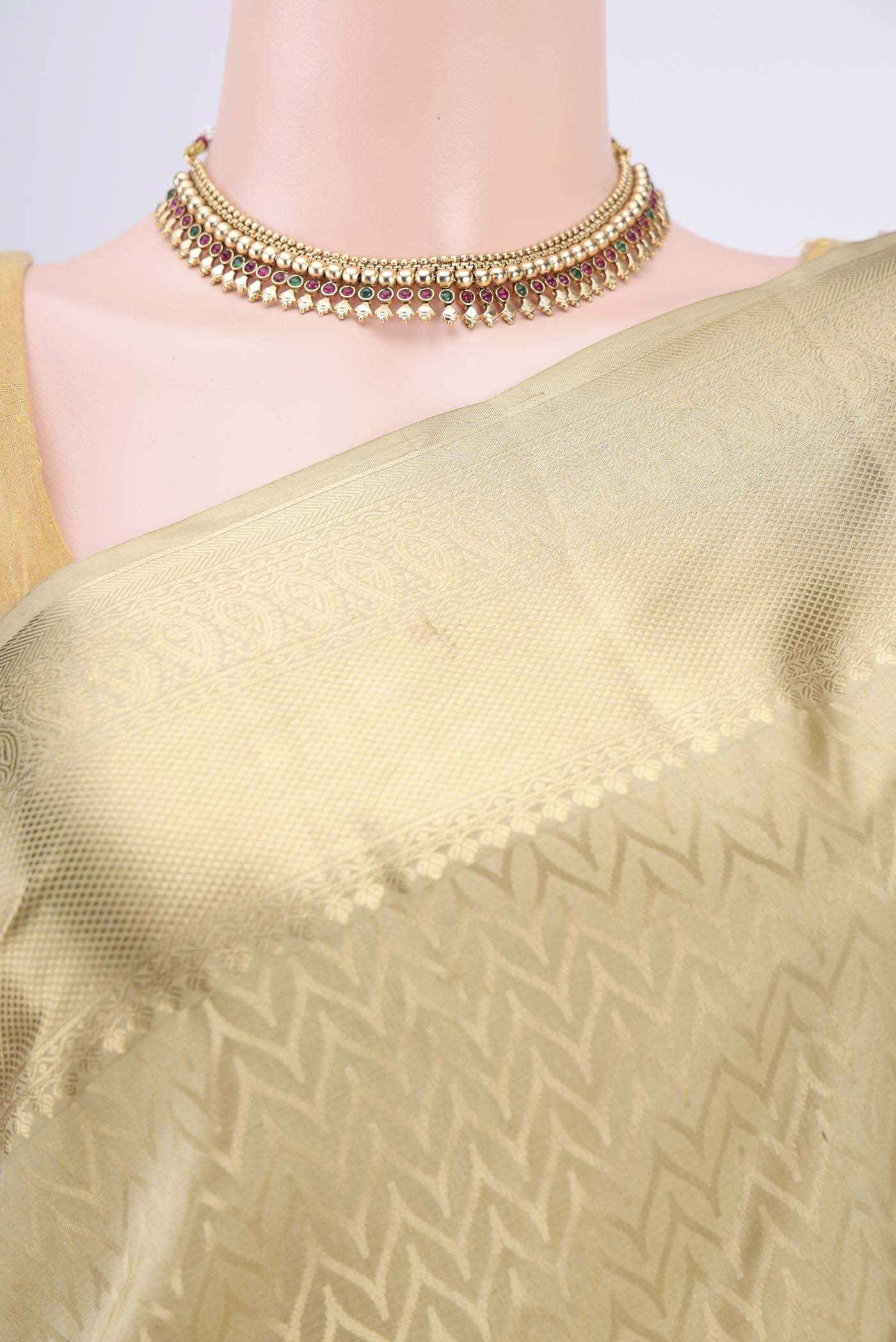 Border image of Dark Beige Soft Silk Saree with Zig Zag design on the body and Zari Border. 