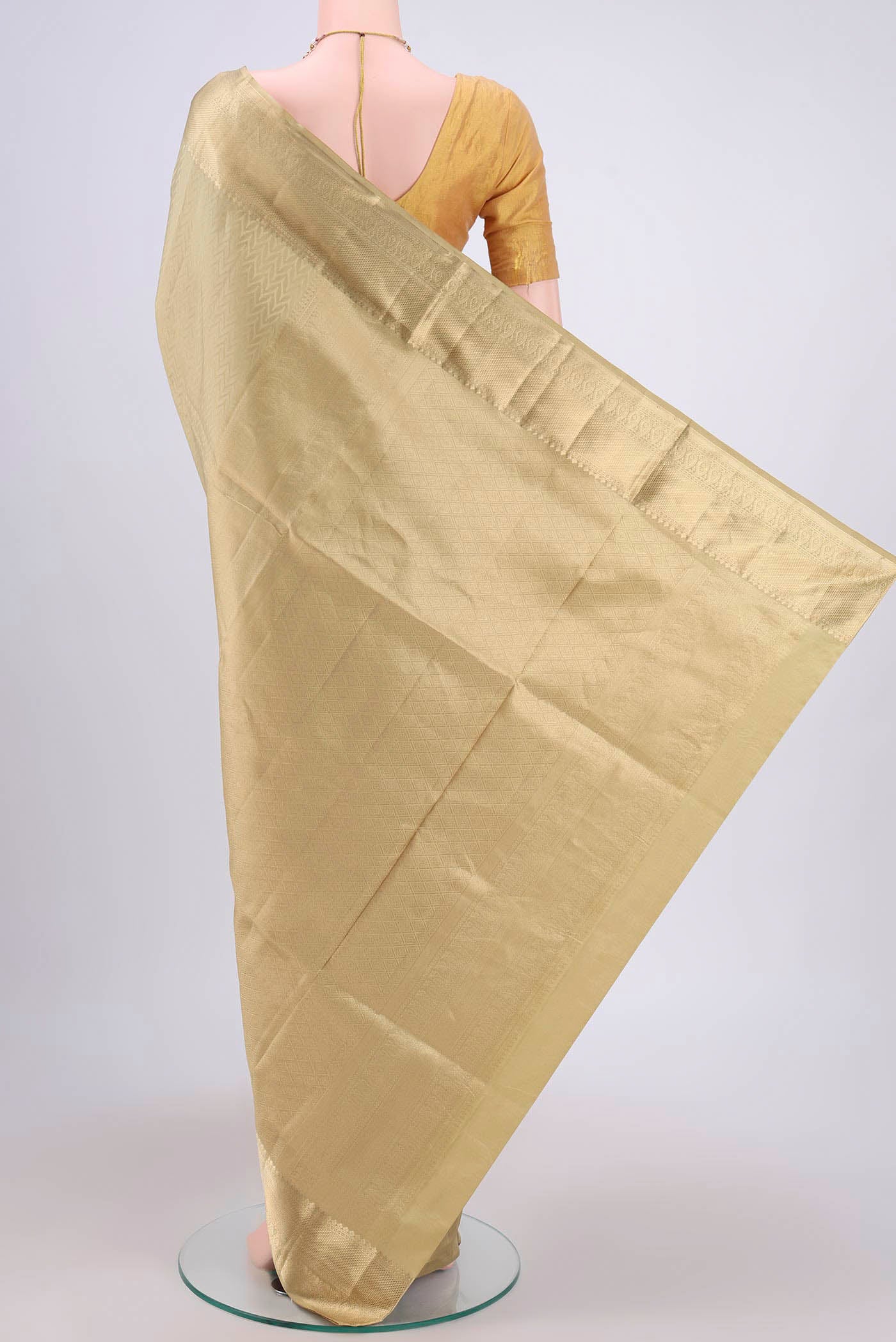 Flat view of Dark Beige Soft Silk Saree with Zig Zag design on the body and Zari Border. 