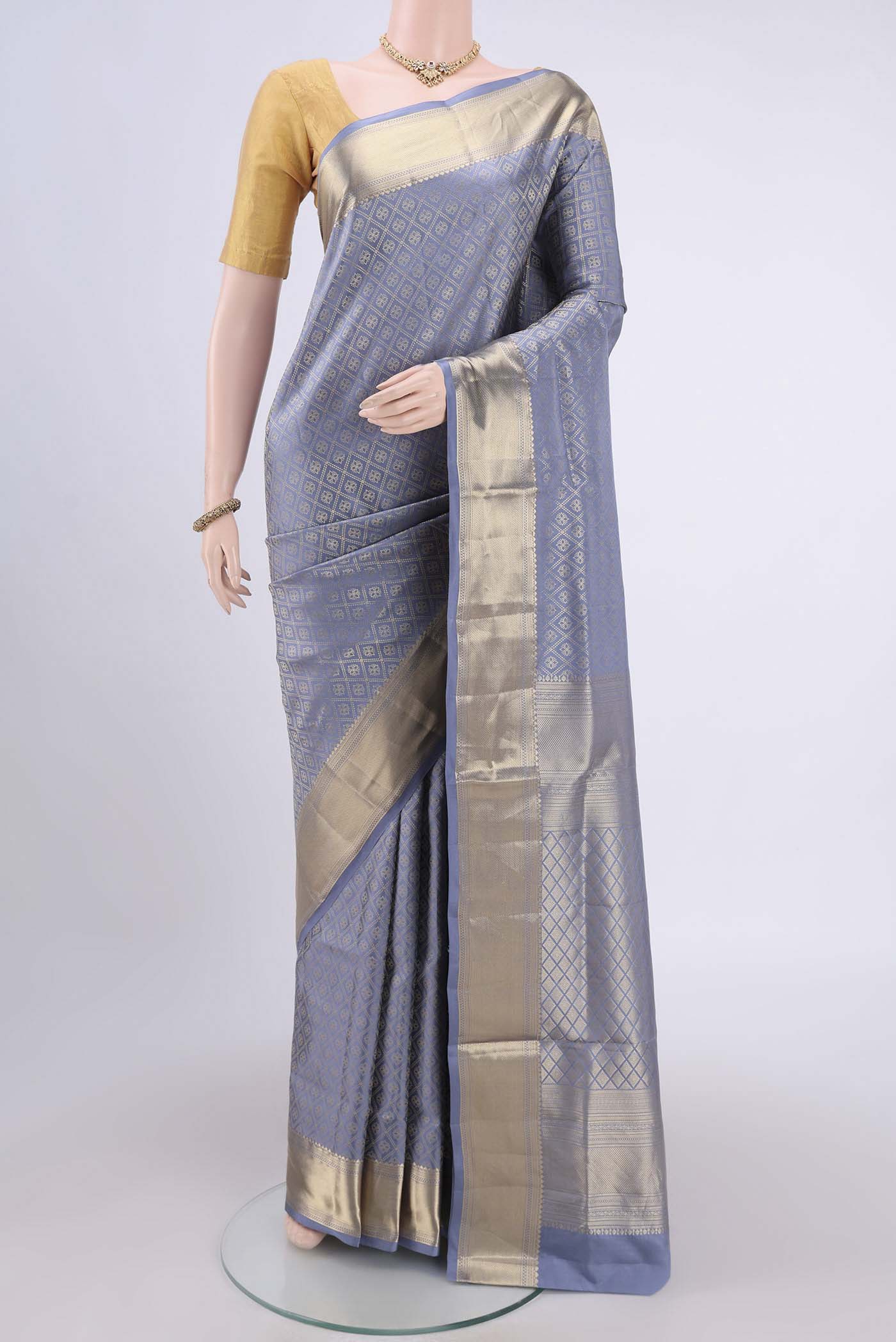Blue Grey Soft Silk Saree with Zari Brocade on the body and Zari Border.  displayed on a mannequin