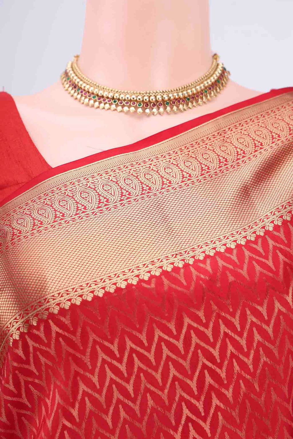 Border image of Red Soft Silk Saree with Zig Zag design on the body and Zari Border. 