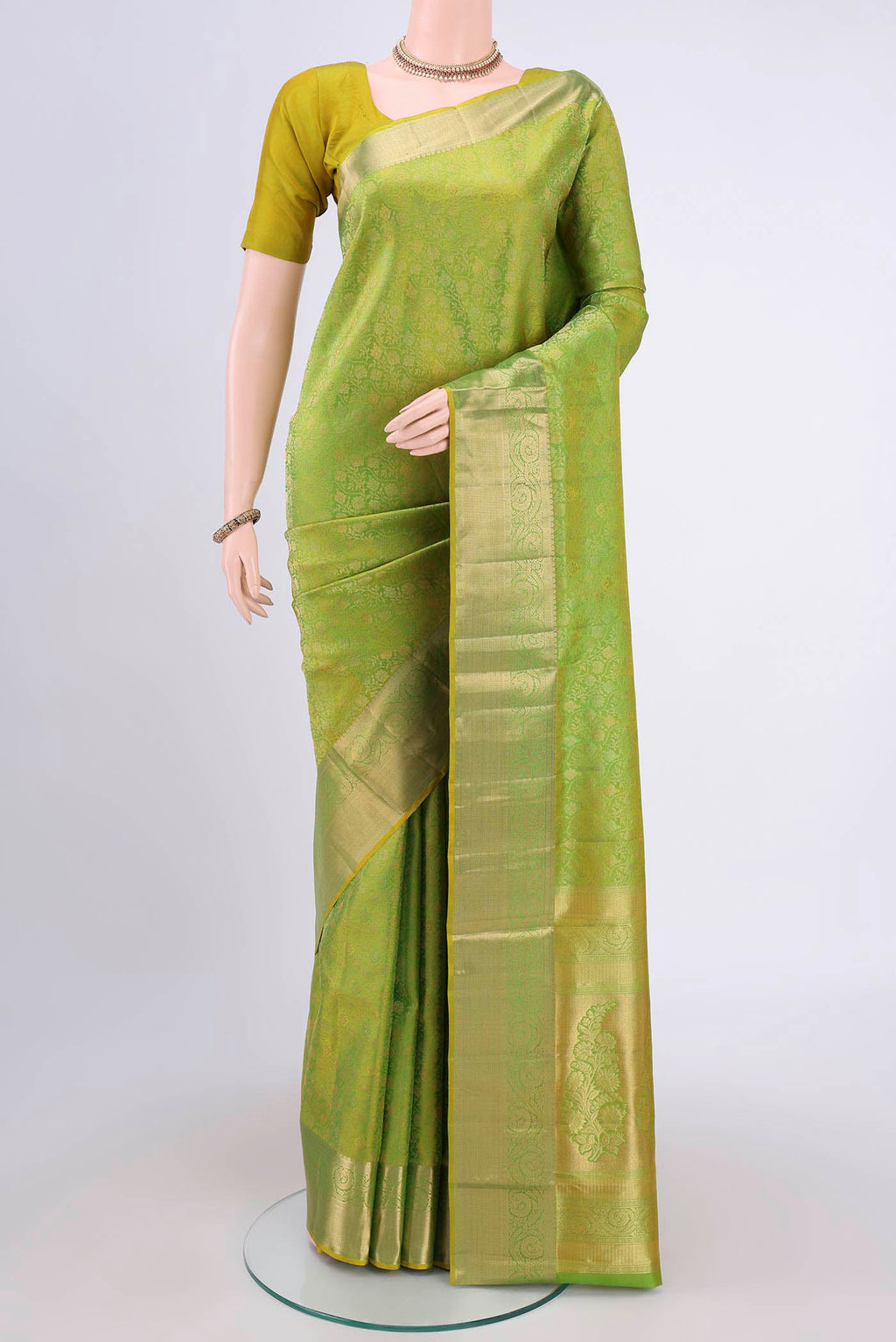 Light Green Dual Tone Soft Silk Saree with Zari Brocade on the body and Zari Border.  displayed on a mannequin
