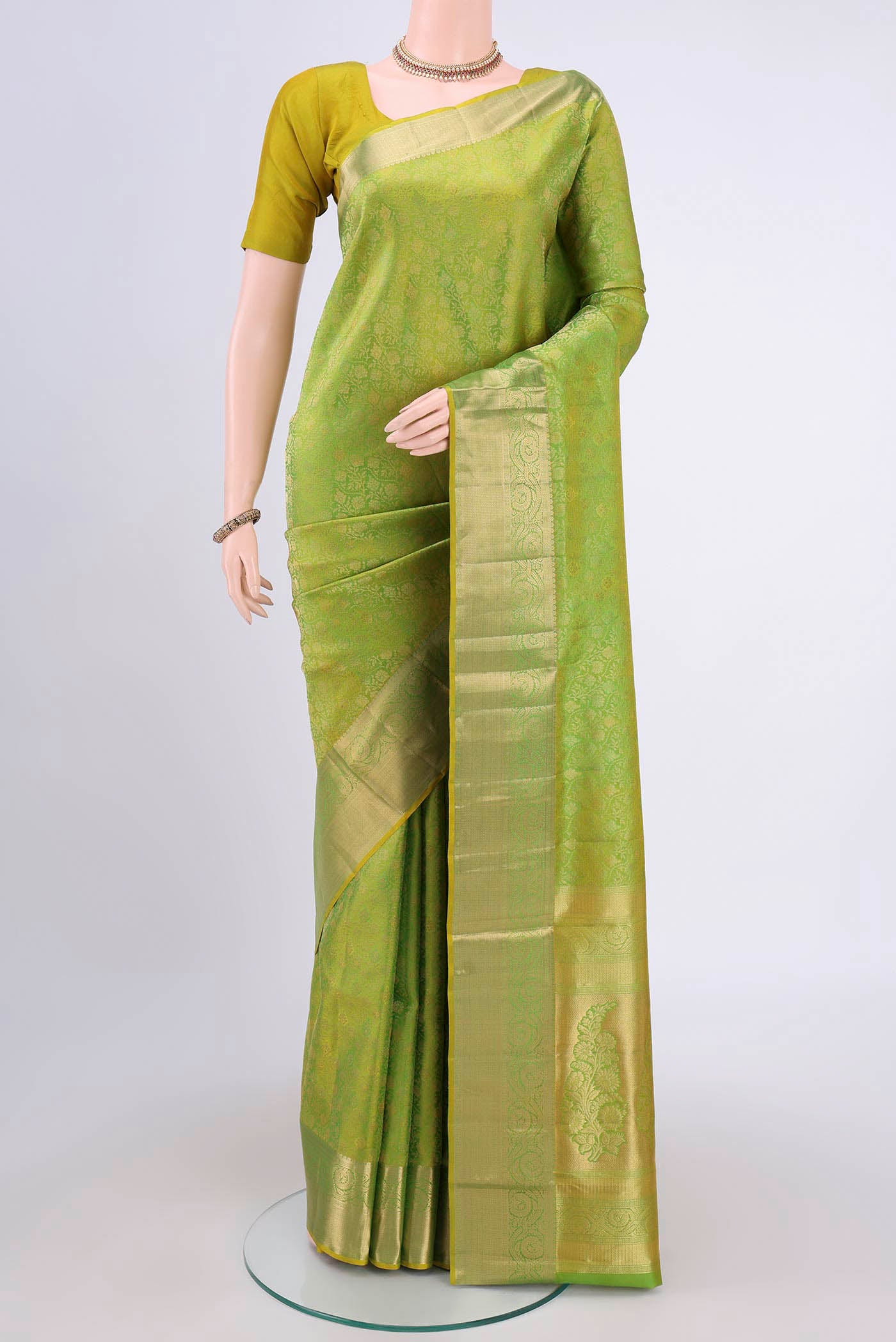 Light Green Dual Tone Soft Silk Saree with Zari Brocade on the body and Zari Border.  displayed on a mannequin