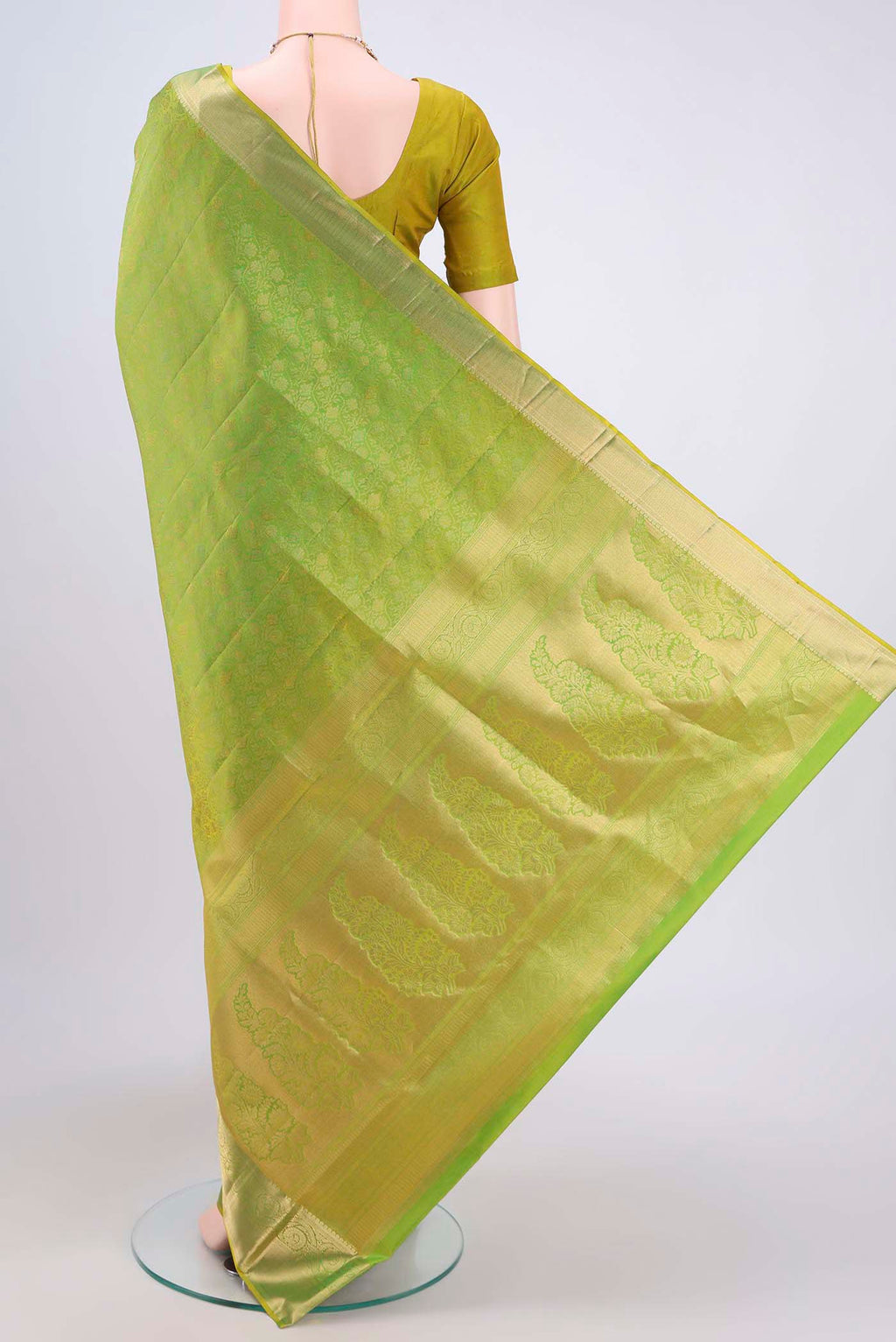 Flat view of Light Green Dual Tone Soft Silk Saree with Zari Brocade on the body and Zari Border. 