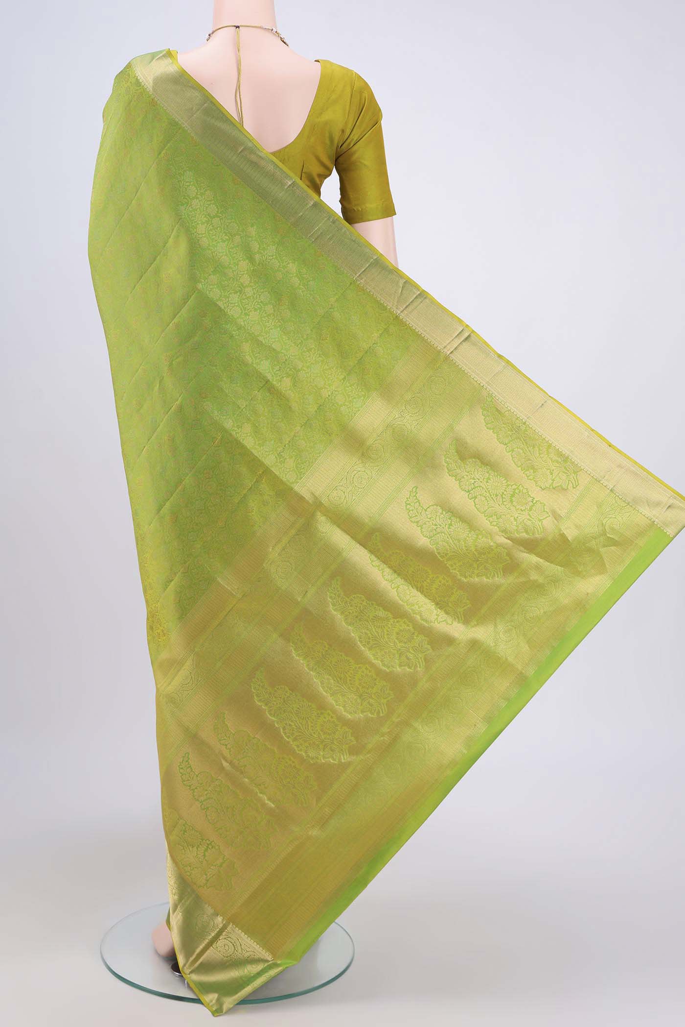 Flat view of Light Green Dual Tone Soft Silk Saree with Zari Brocade on the body and Zari Border. 