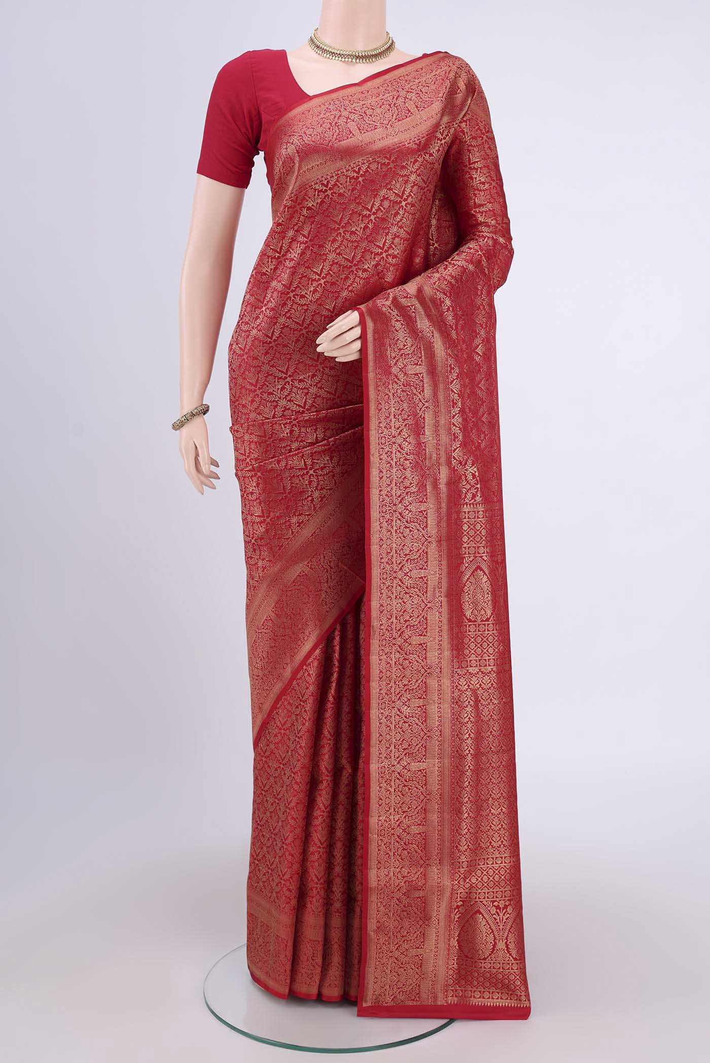 Maroon Soft Silk Saree with Zari Brocade on the body and Zari Border.  displayed on a mannequin