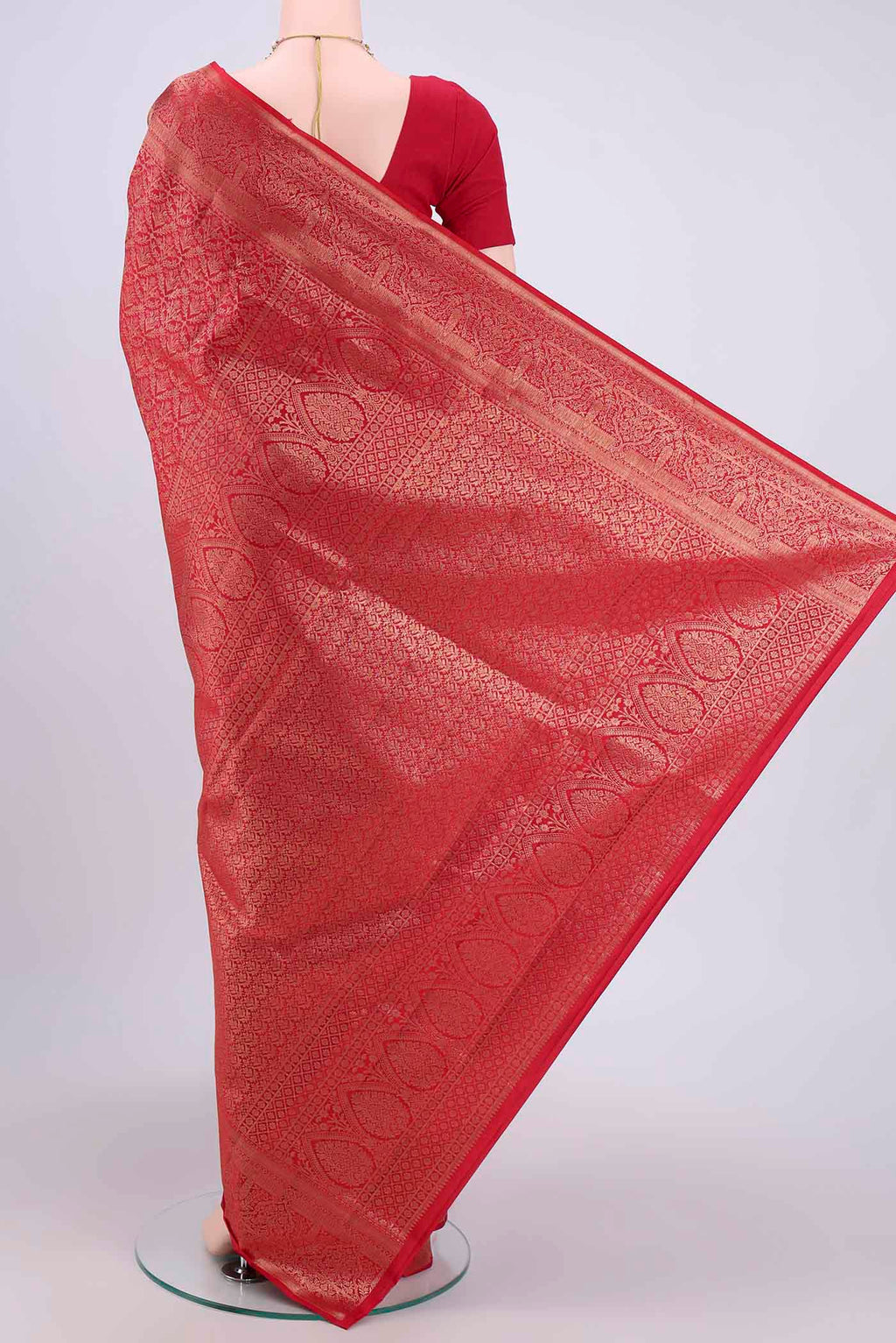 Flat view of Maroon Soft Silk Saree with Zari Brocade on the body and Zari Border. 