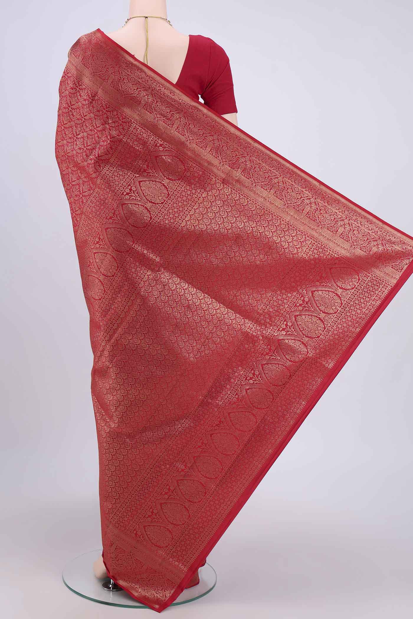 Flat view of Maroon Soft Silk Saree with Zari Brocade on the body and Zari Border. 