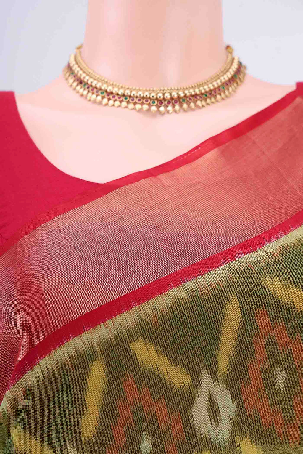 Border image of Mehandi Green Kora Cotton Saree with Ikat design on the body and Zari Border