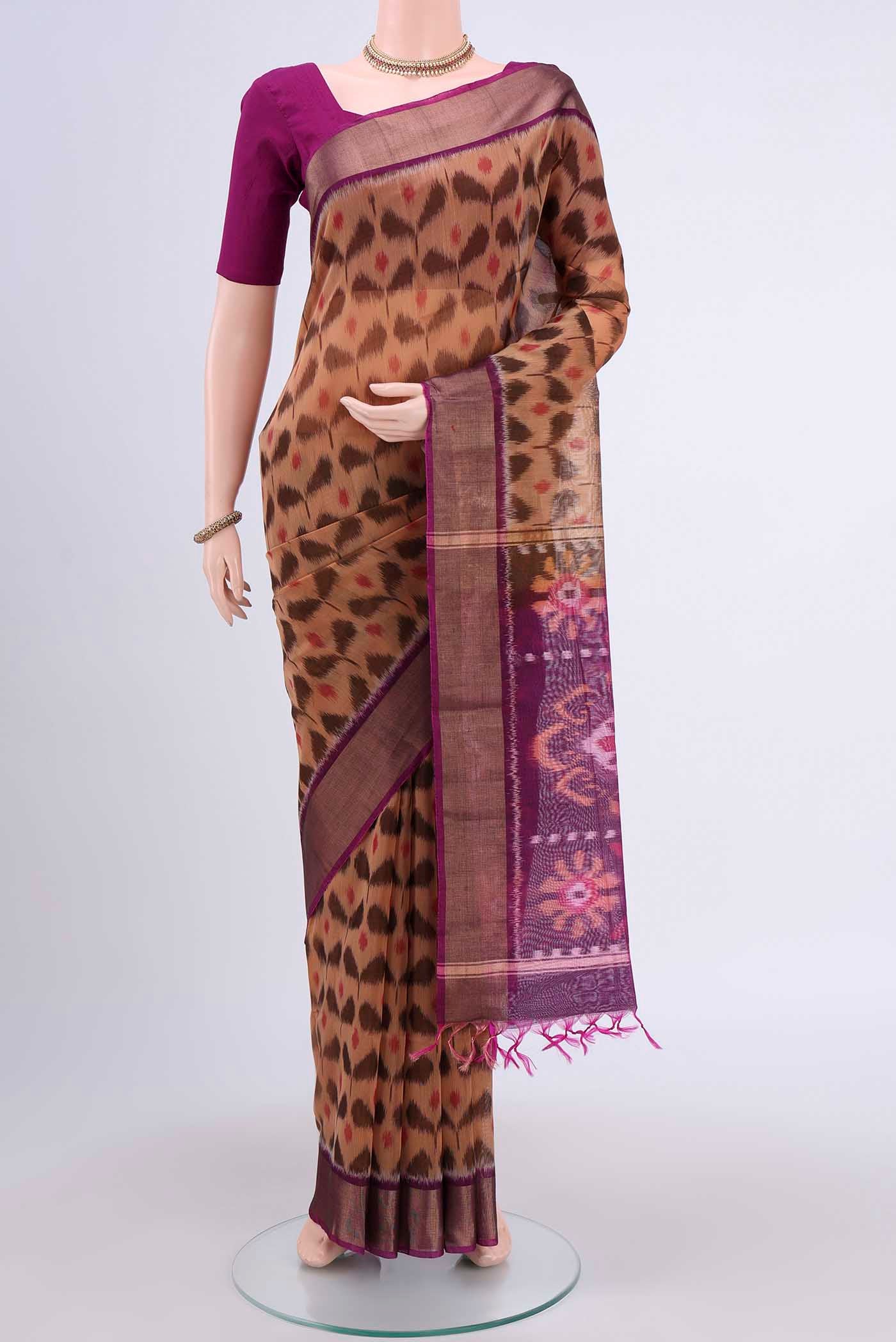 Dark Beige Kota Cotton Saree with Ikat design on the body and Zari Border displayed on a mannequin