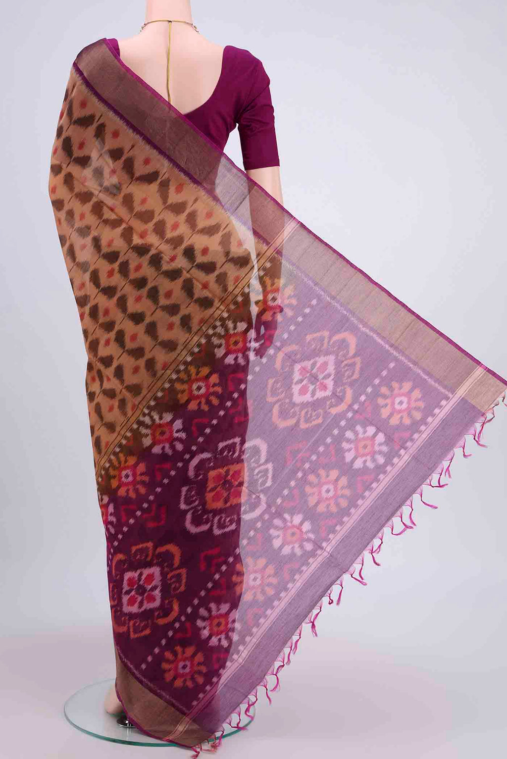 Flat view of Dark Beige Kota Cotton Saree with Ikat design on the body and Zari Border