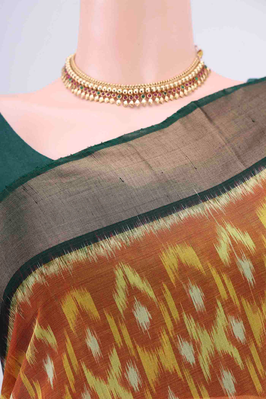 Border image of Brick Orange Kora Cotton Saree with Ikat design on the body and Zari Border