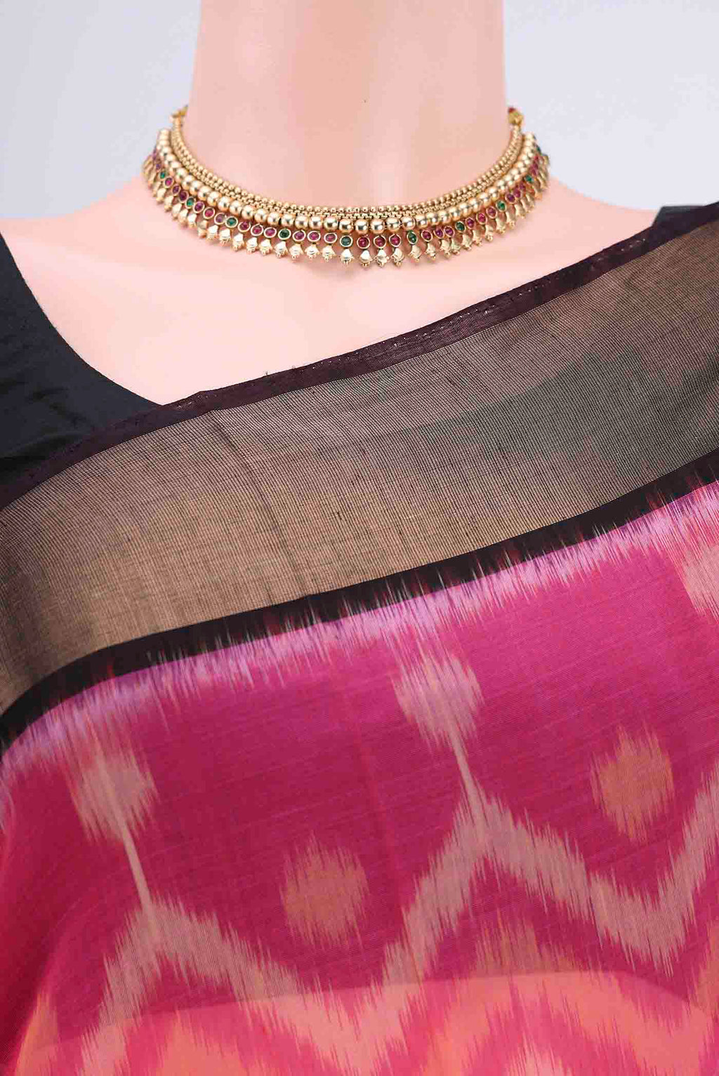 Border image of Rani Pink Kora Cotton Saree with Ikat design on the body and Zari Border