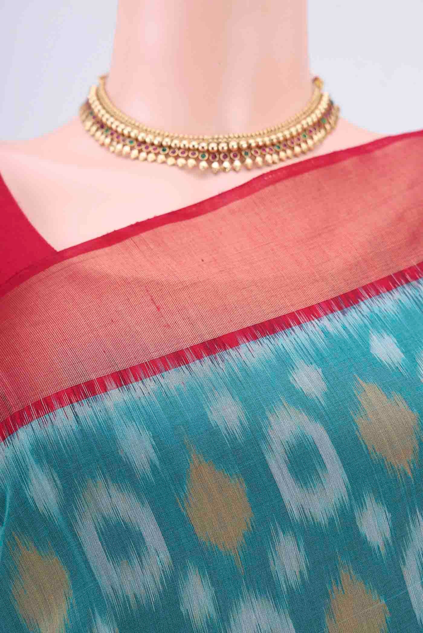 Border image of Sea Green Kora Cotton Saree with Ikat design on the body and Zari Border