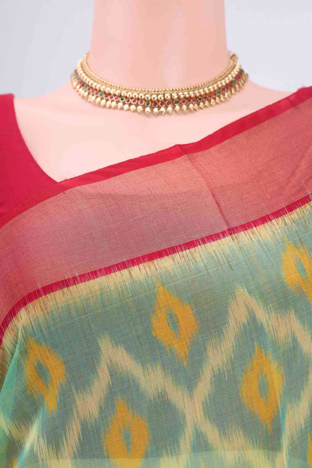Border image of Acid Green Silk Cotton Saree with Ikat design on the body and Zari Border. 