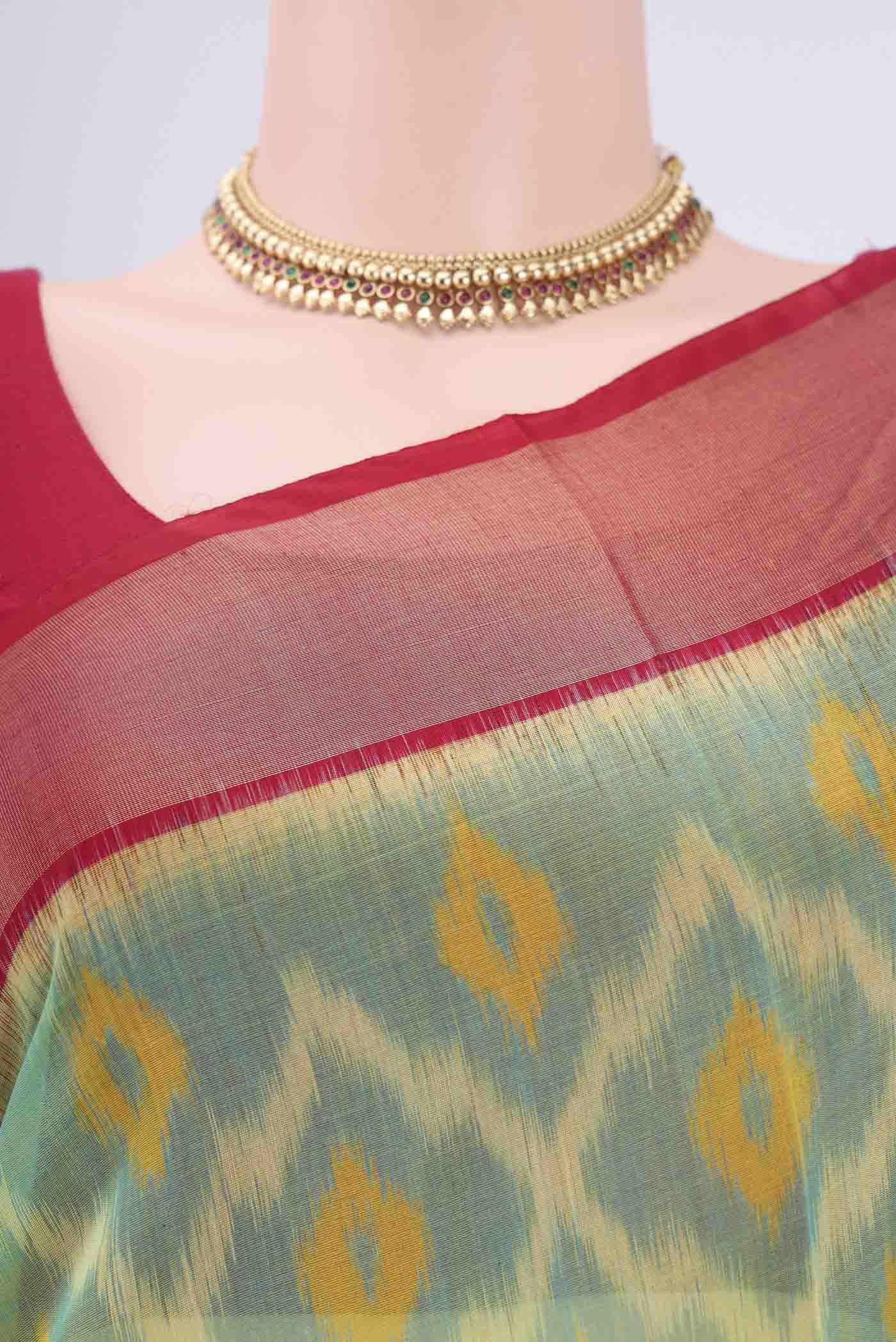 Border image of Acid Green Silk Cotton Saree with Ikat design on the body and Zari Border. 