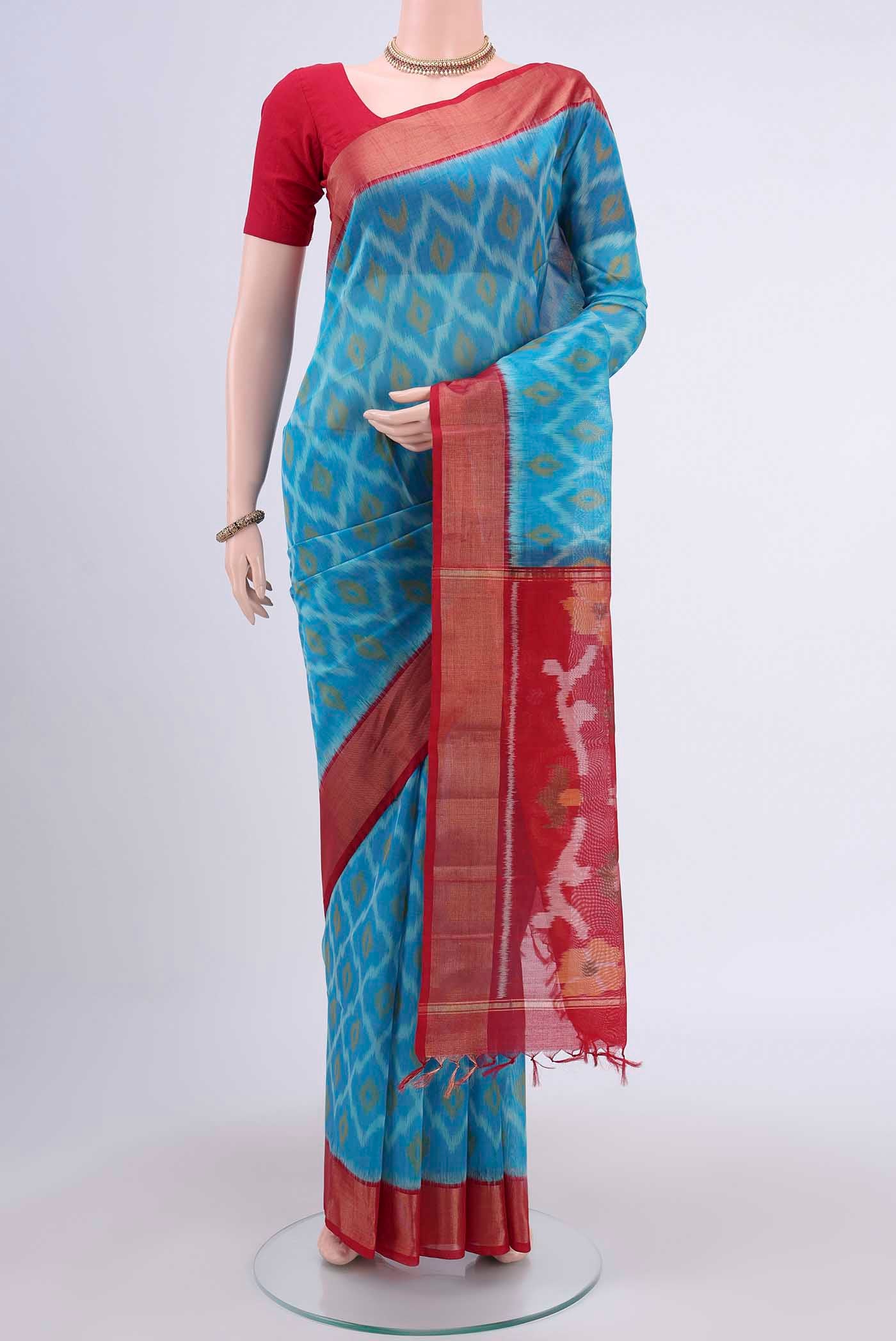 Blue Kora Cotton Saree with Ikat design on the body and Zari Border displayed on a mannequin