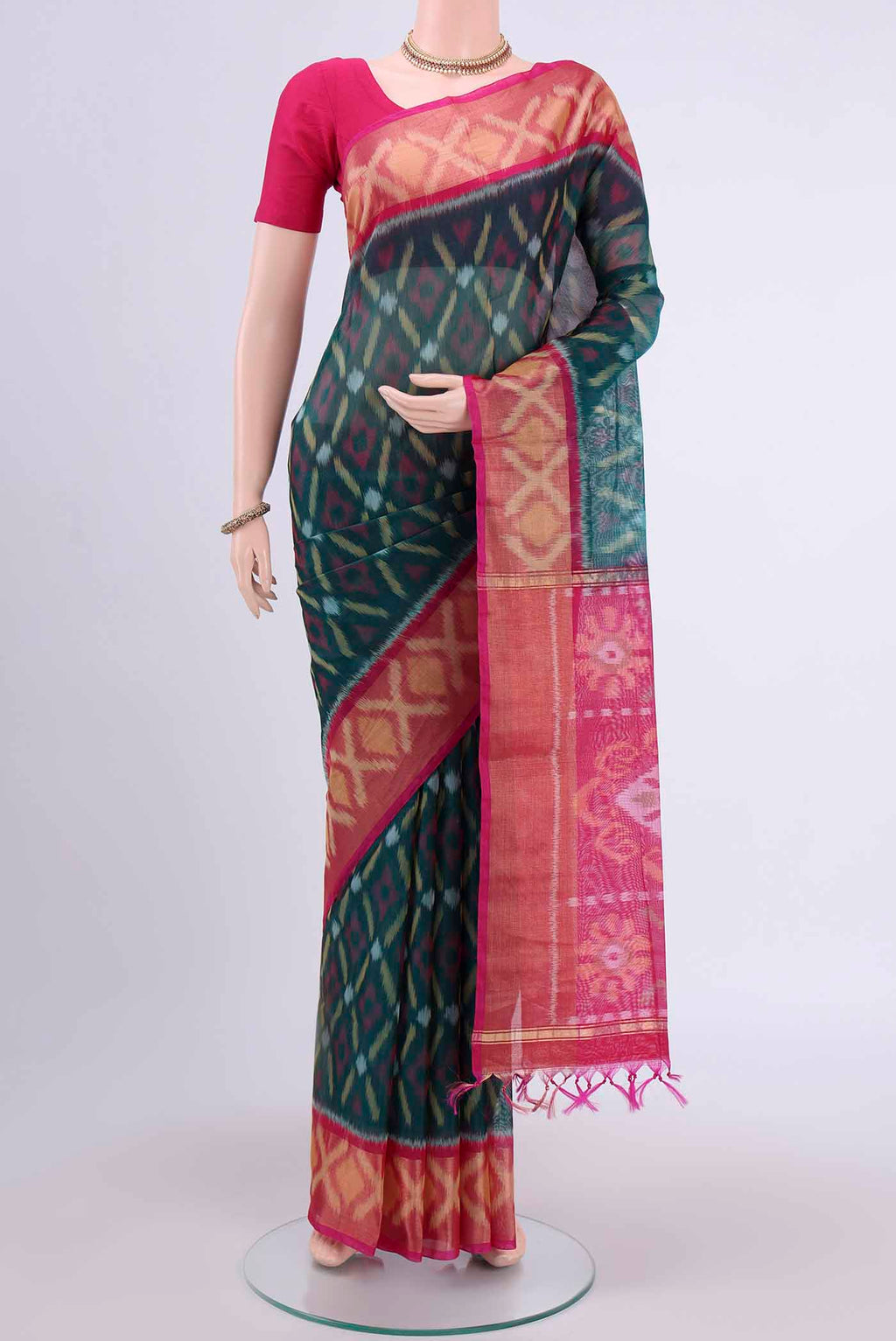 Peacock Blue Kora Cotton Saree with Ikat design on the body and Zari Border displayed on a mannequin
