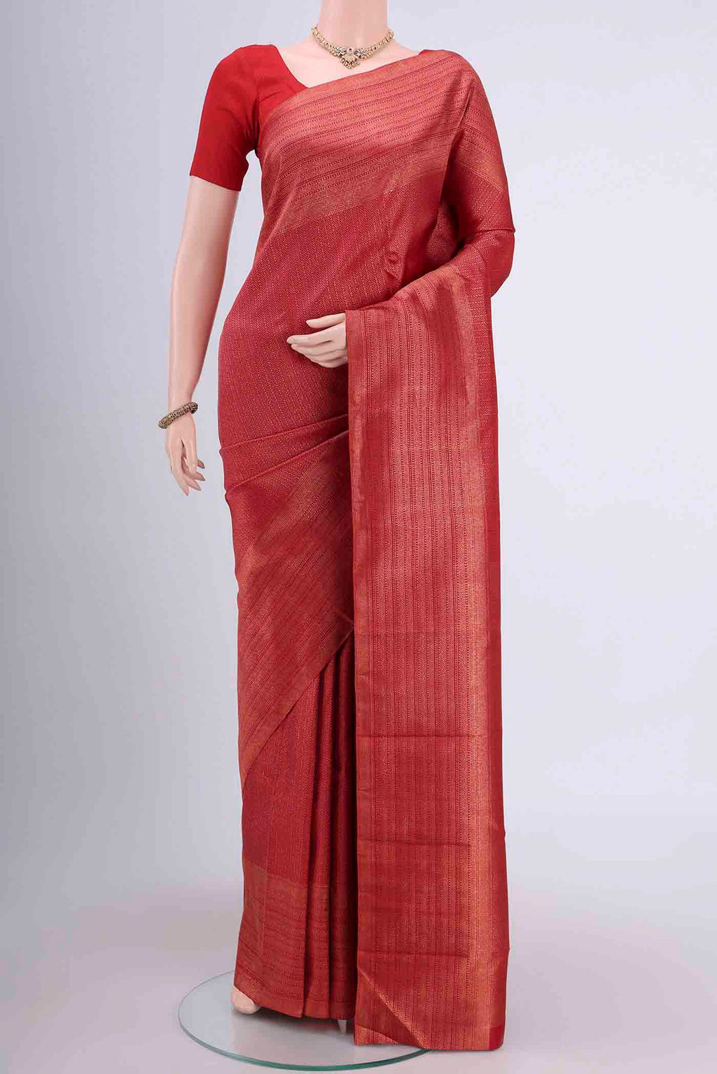 Red Dual Tone Kanchipuram Saree with Zari Brocade on the body and Zari Border displayed on a mannequin